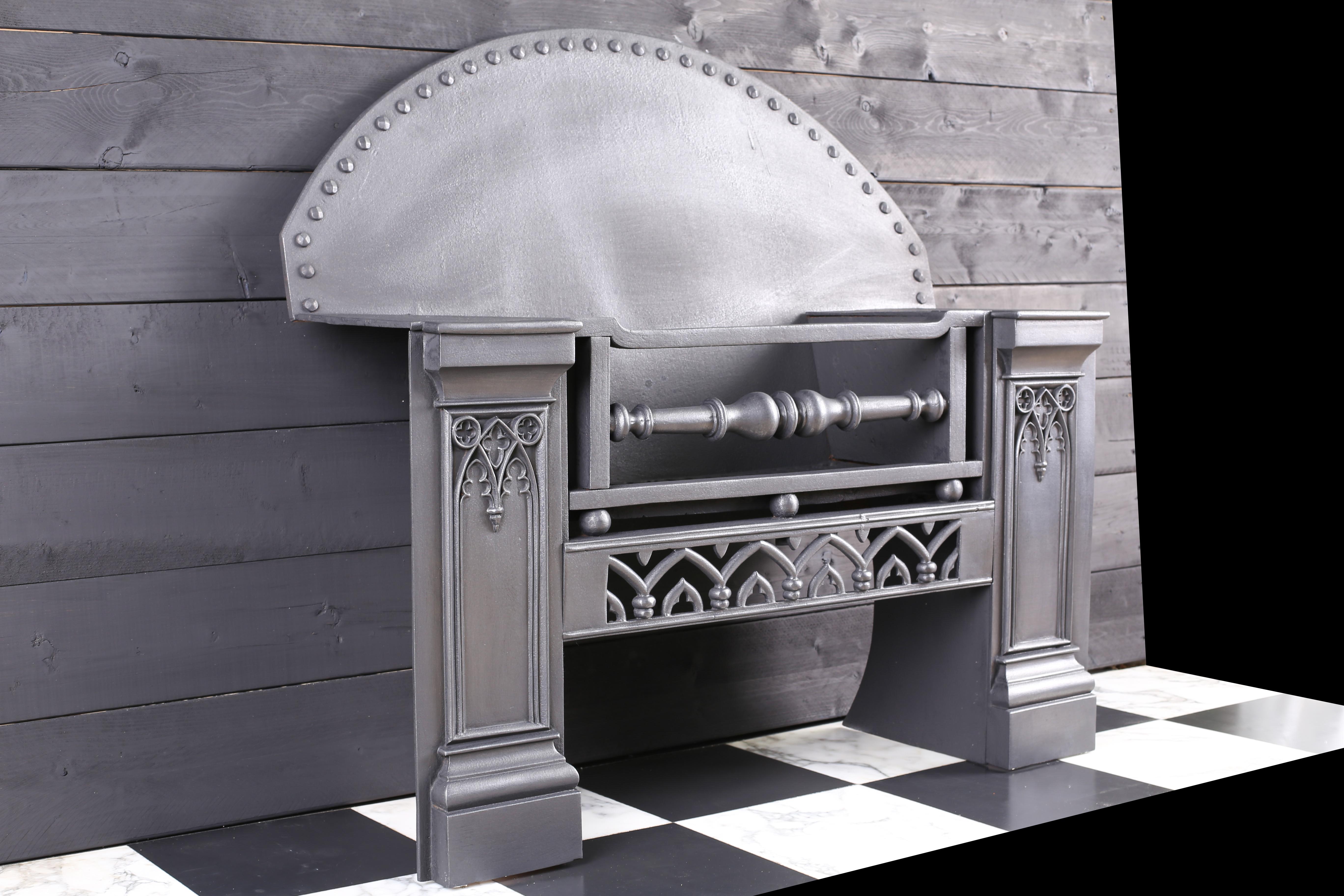 A Grand Cast Iron Victorian Gothic Revival Hob Grate Fireplace, English, C.1860.

Size: Depth: 14 ½” – 37cm
External Height: 35” – 89cm
External Width: 35 ½ – 90cm.