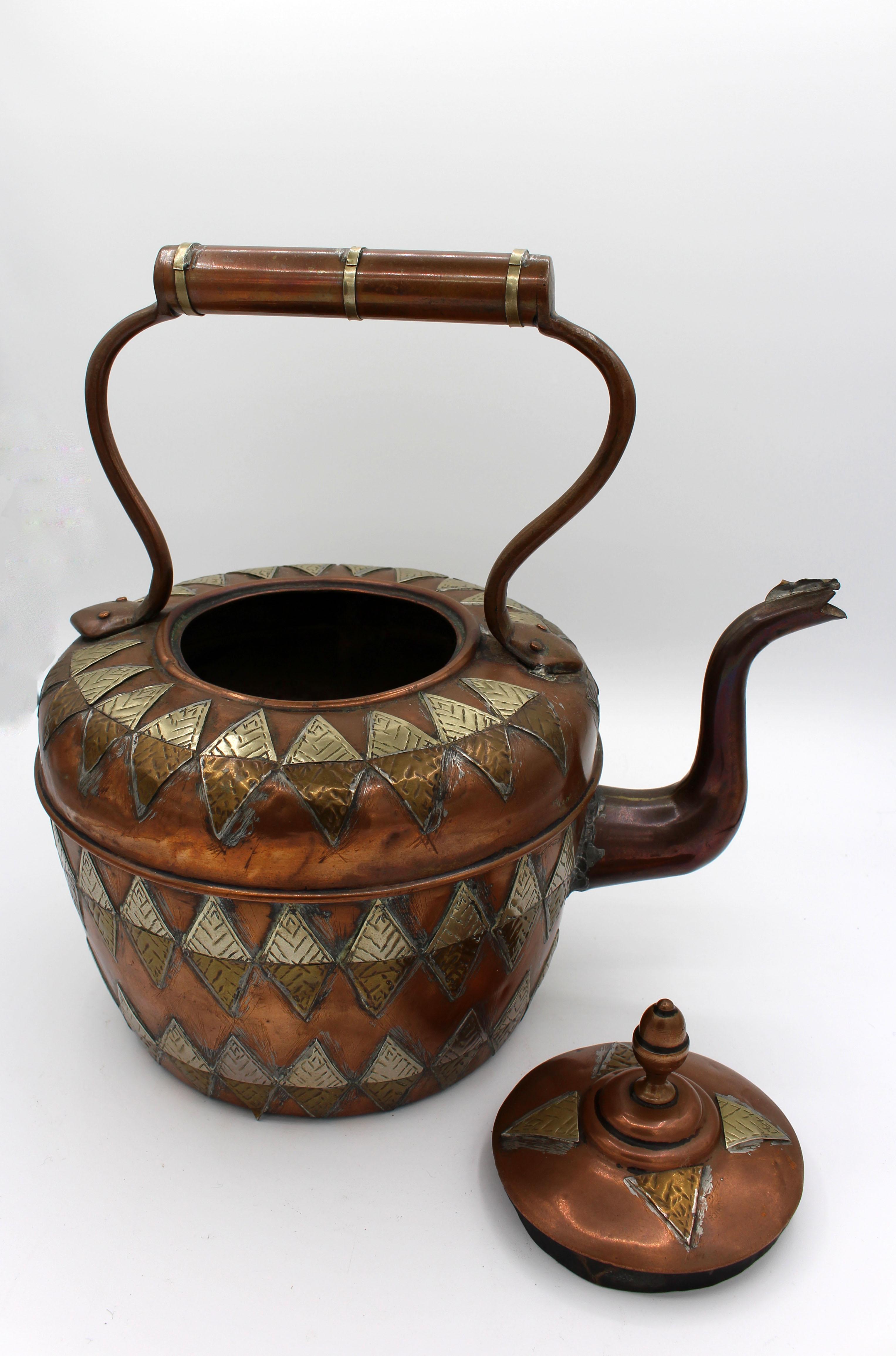 A grand copper Raj Period tea kettle in Anglo-Indian Taste with cut-work decorative overlays of brass. Old spout repair. Late 19th century.

We have been a major source for the selective buyer for over 90 years. Whitehall is one the finest
