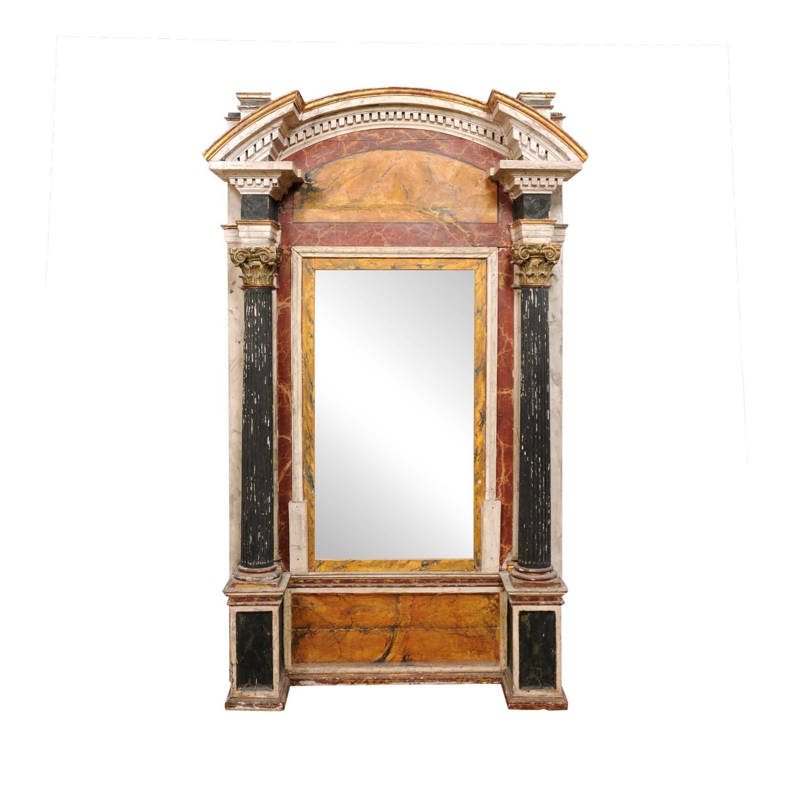 An Italian large-scale architectural floor mirror, with its original paint, from the 19th century. This antique mirror from Italy is grand in scale, standing just shy of 8.5 feet in height, and over 5 feet wide. This 19th century architectural