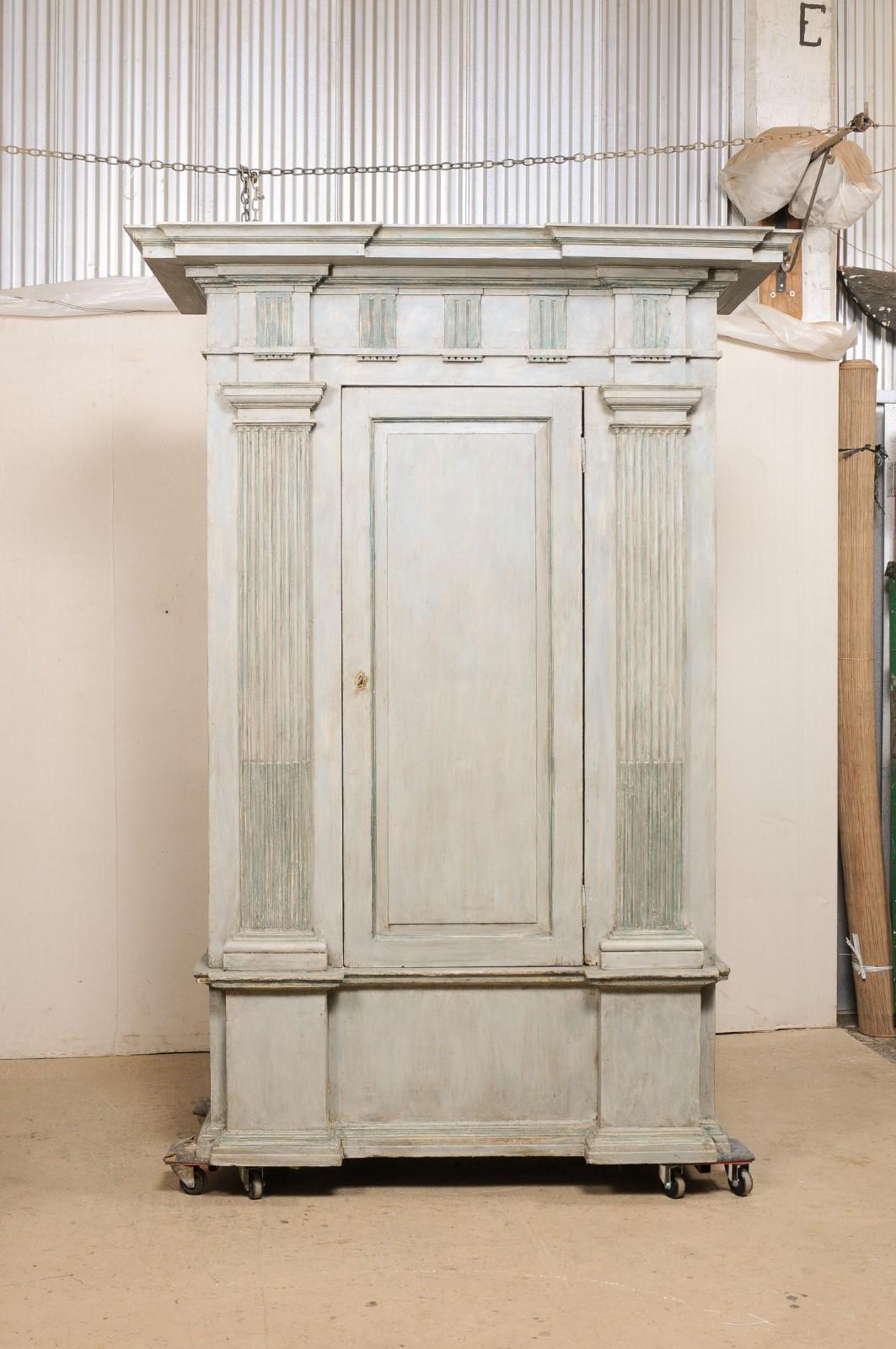 An Italian large-sized cabinet, with inner cedar trunk, from the turn of the 18th and 19th century. This antique guardaroba (wardrobe) from Italy is impressively sized at approximately 8.25 feet in height and nearly 6 feet wide. The cabinet is