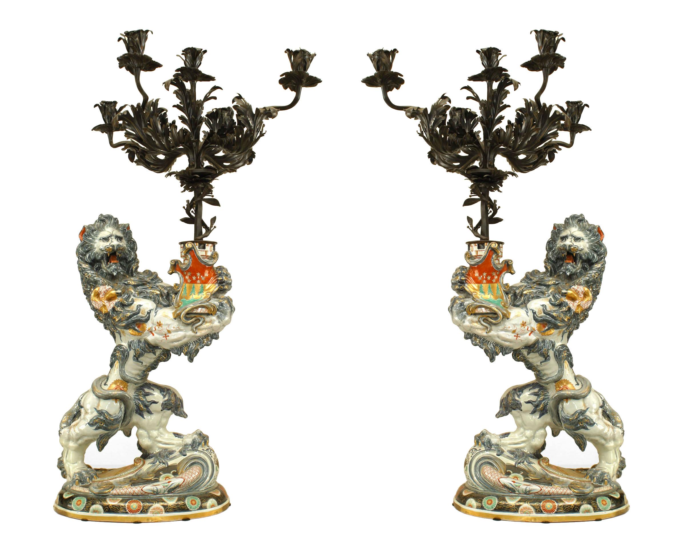 19th Century Pair of French Porcelain Lions Holding Wrought Iron Candelabras For Sale