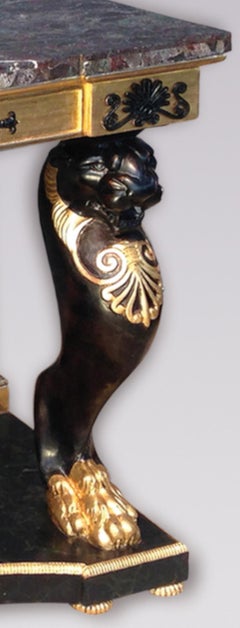 A grand Pair of 19th Century Regency Gilt and Ebonized Console Tables