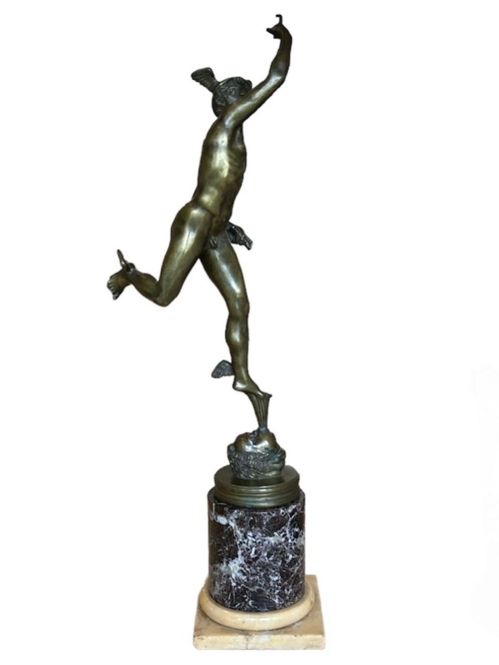A bronze on a marble column after Giovanni Bologna, depicting the Roman god Mercury messenger of the gods flying through the air raised on a path of air made by the mouth of a cherub aided by his wing feet and helmet. 
A symbol of peace and trade.