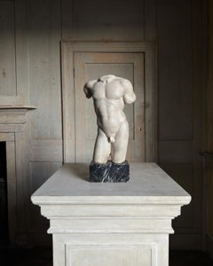 A Grand Tour marble torso of an athlete, after the antique.