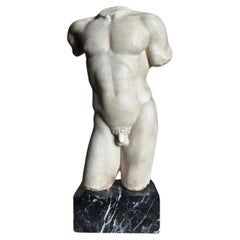 A Grand Tour marble torso of an athlete, after the antique.