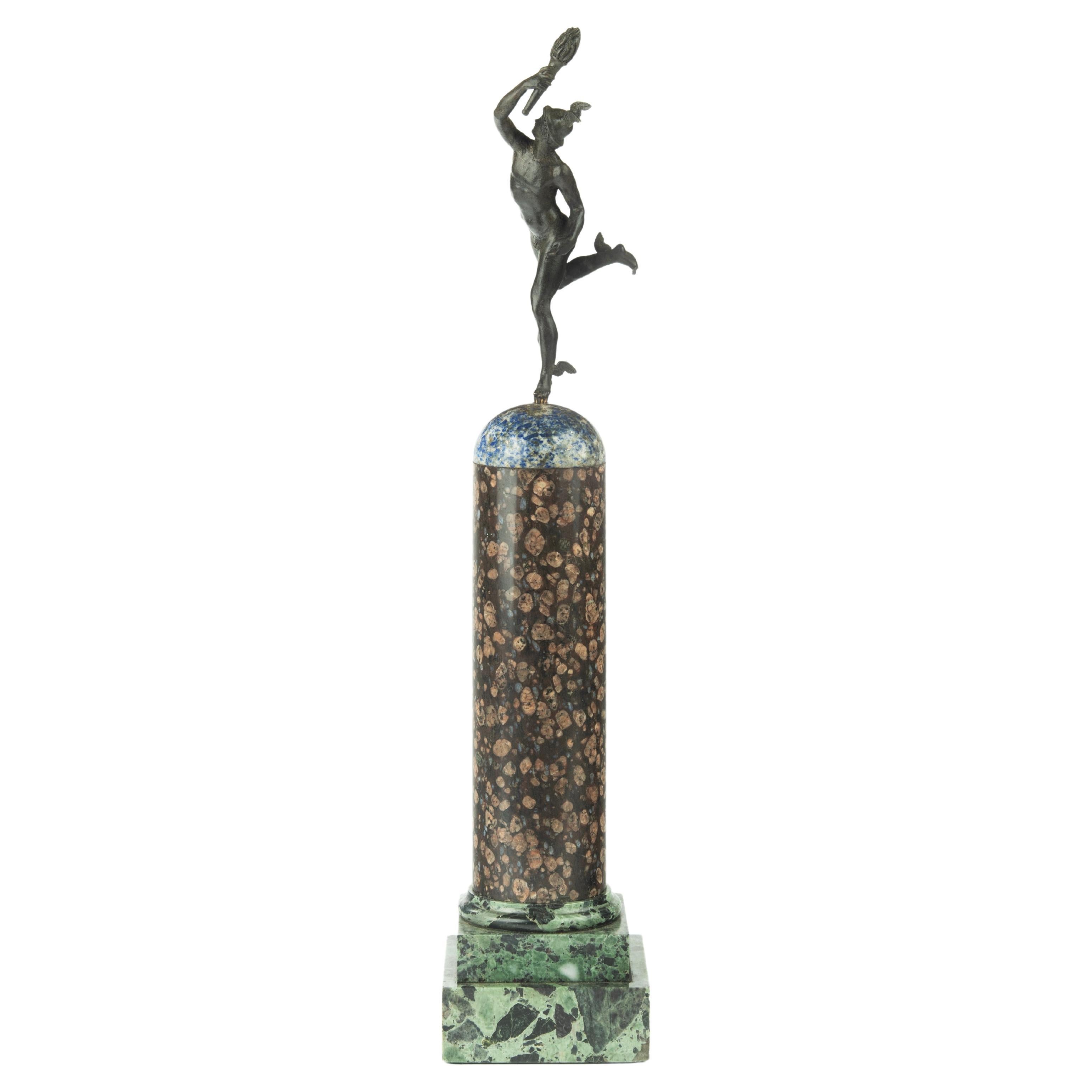 A Grand Tour Regency bronze figure of Mercury (Hermes) on a marble column