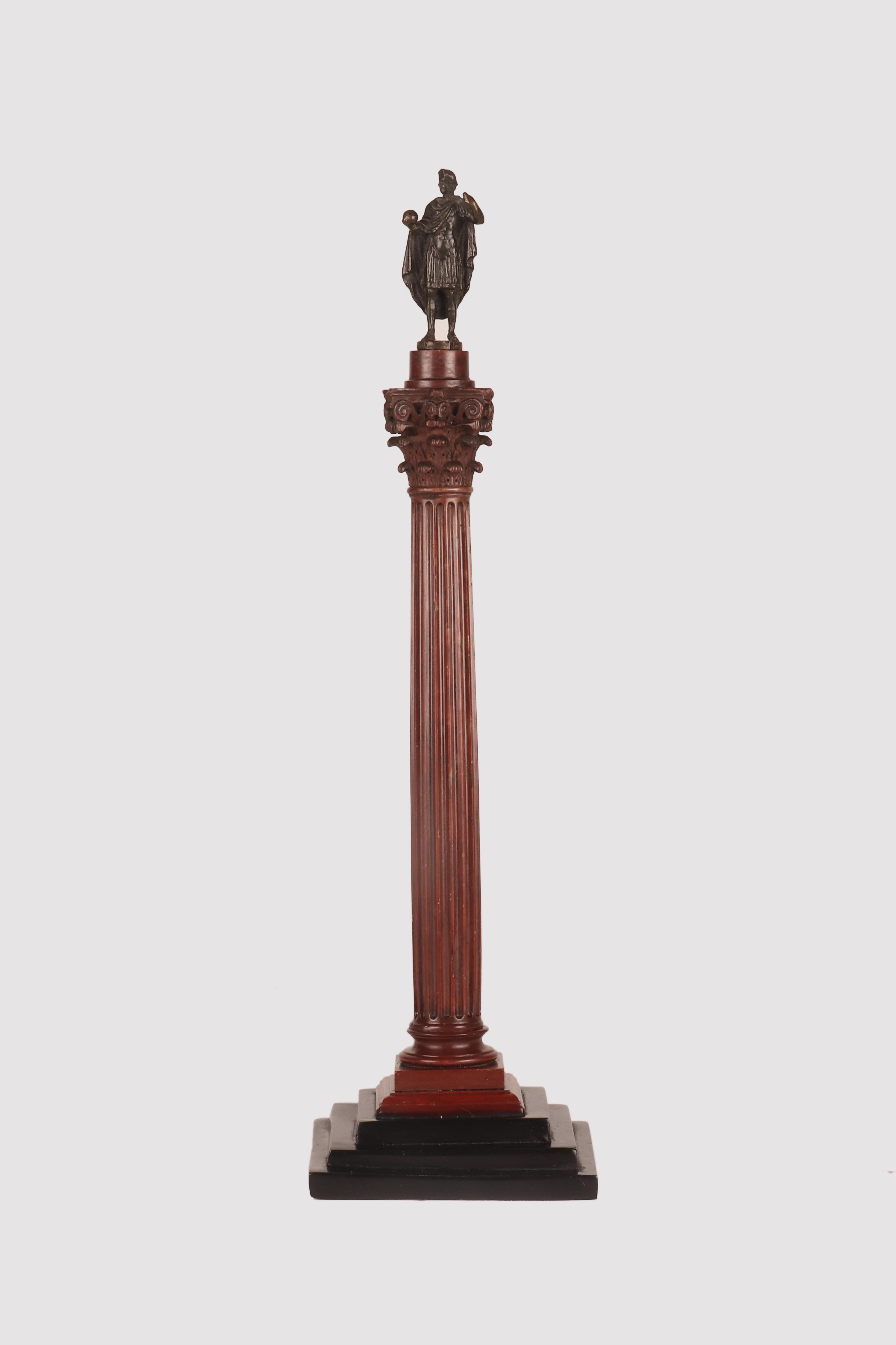 A souvenir of the Grand Tour, Rome stage. Trajan's column.
The famous monument is representative of Rome, Caput Mundi, and the greatest empire of its time in its maximum splendor. Here the monument is represented in red marble with at the top the