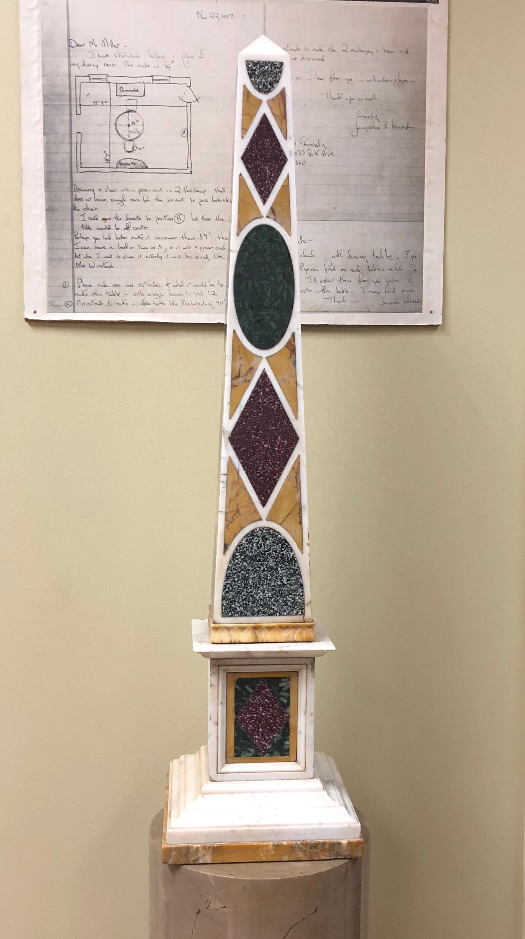 The obelisk inlaid with granite, red and green porphyry on a ground of white and yellow marbles.