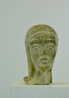 A granite sculpture of a young woman's head  - France - 1960