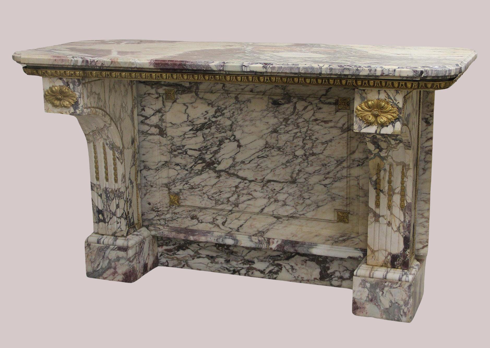 A Great Quality Late 19th Century Gilt Bronze Mounted Marble Console

The excellent brocatelle rouge shaped marble top above a gilt bronze frieze, hand carved mounted legs with the matching etched backsplash, and standing on rectangular bases.