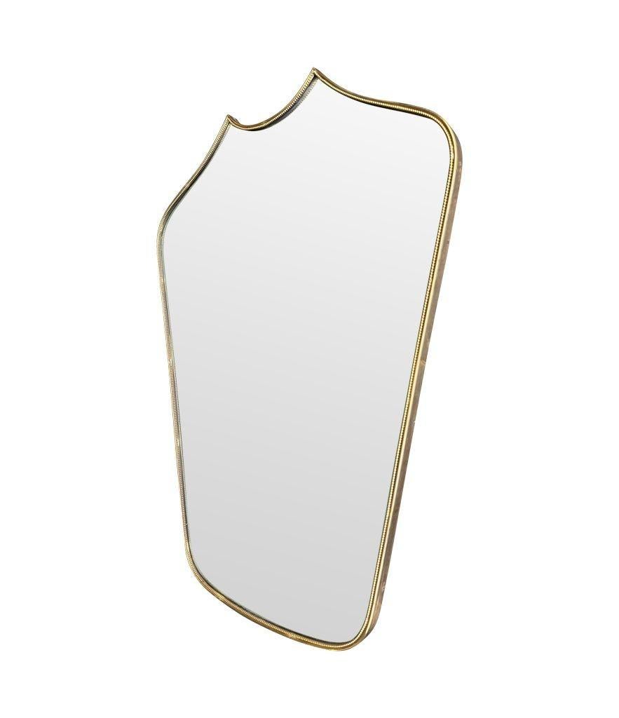 A great shaped orignal Italian 1950s shield mirror with brass beaded frame In Good Condition In London, GB