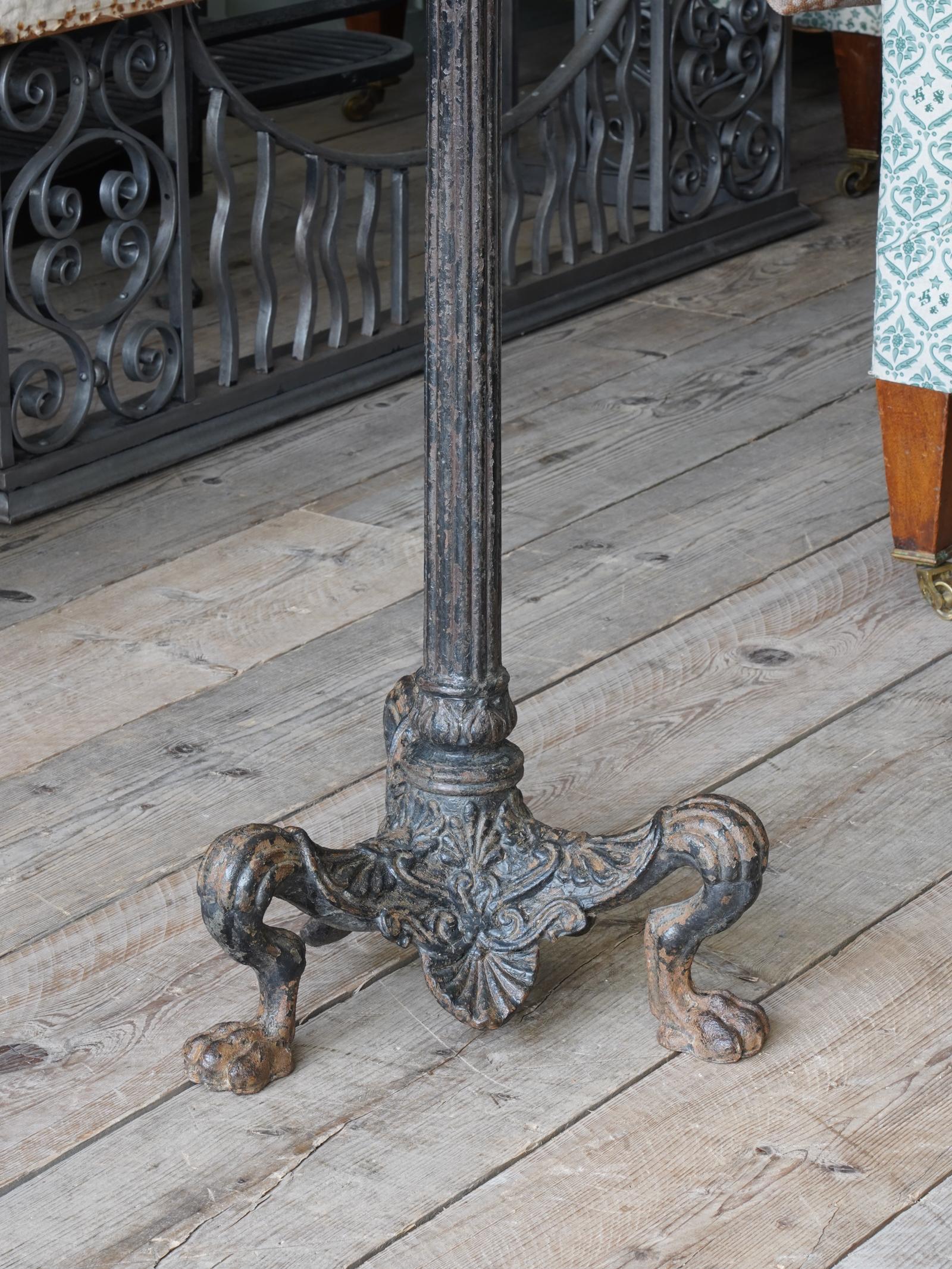Raised on animalistic leg with lions paw feet, anthemion decorations to the skirt, reeded tapering column terminating in acanthus with bowl above.

Originally an oil lamp with glass uplighter would have topped this piece, but the space left is