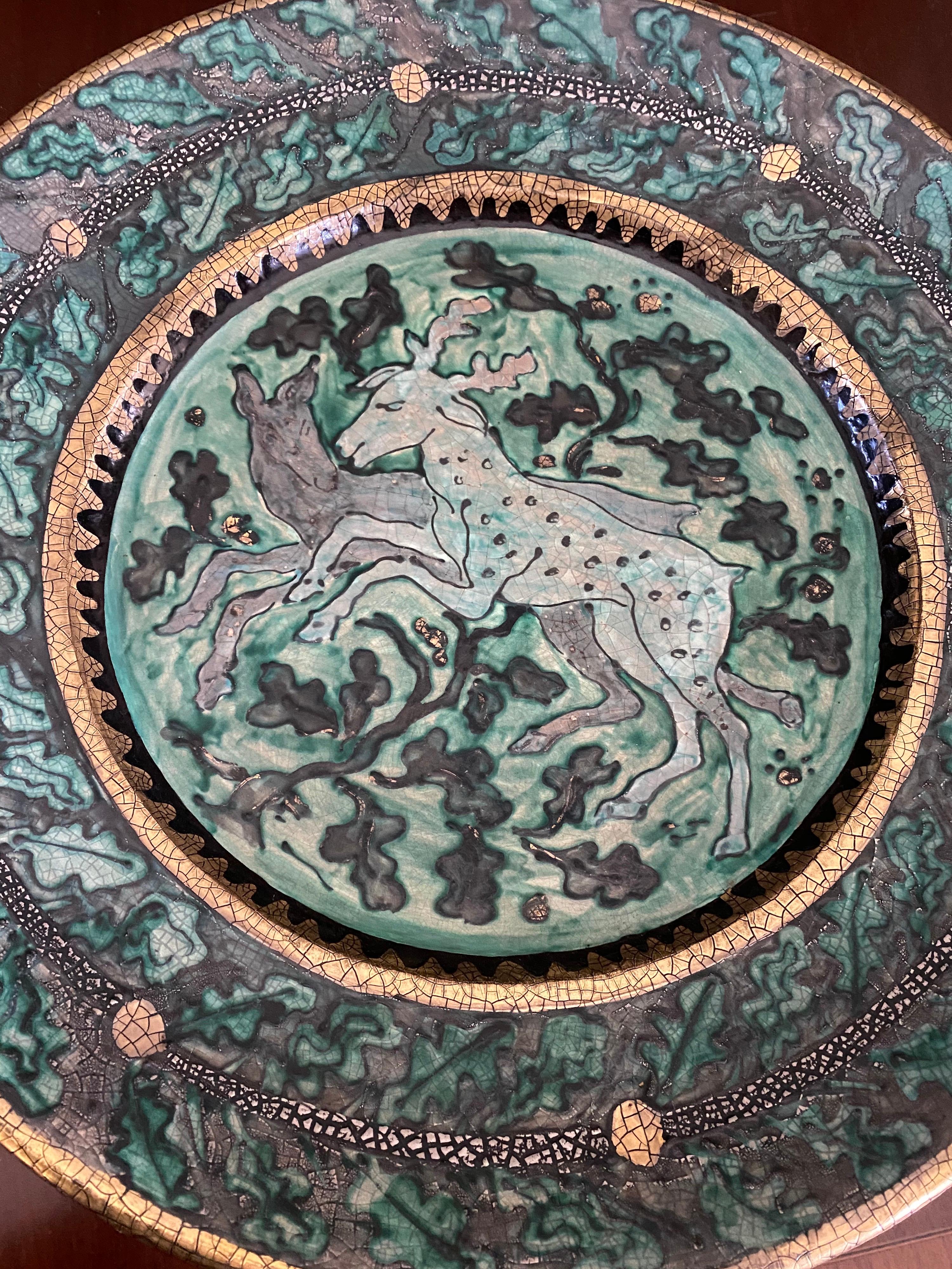 Depicting 2 prancing reindeer amidst tree foliage
Impressed with artist's monogram and iron cross
Glazed earthenware
circa 1917-1919.