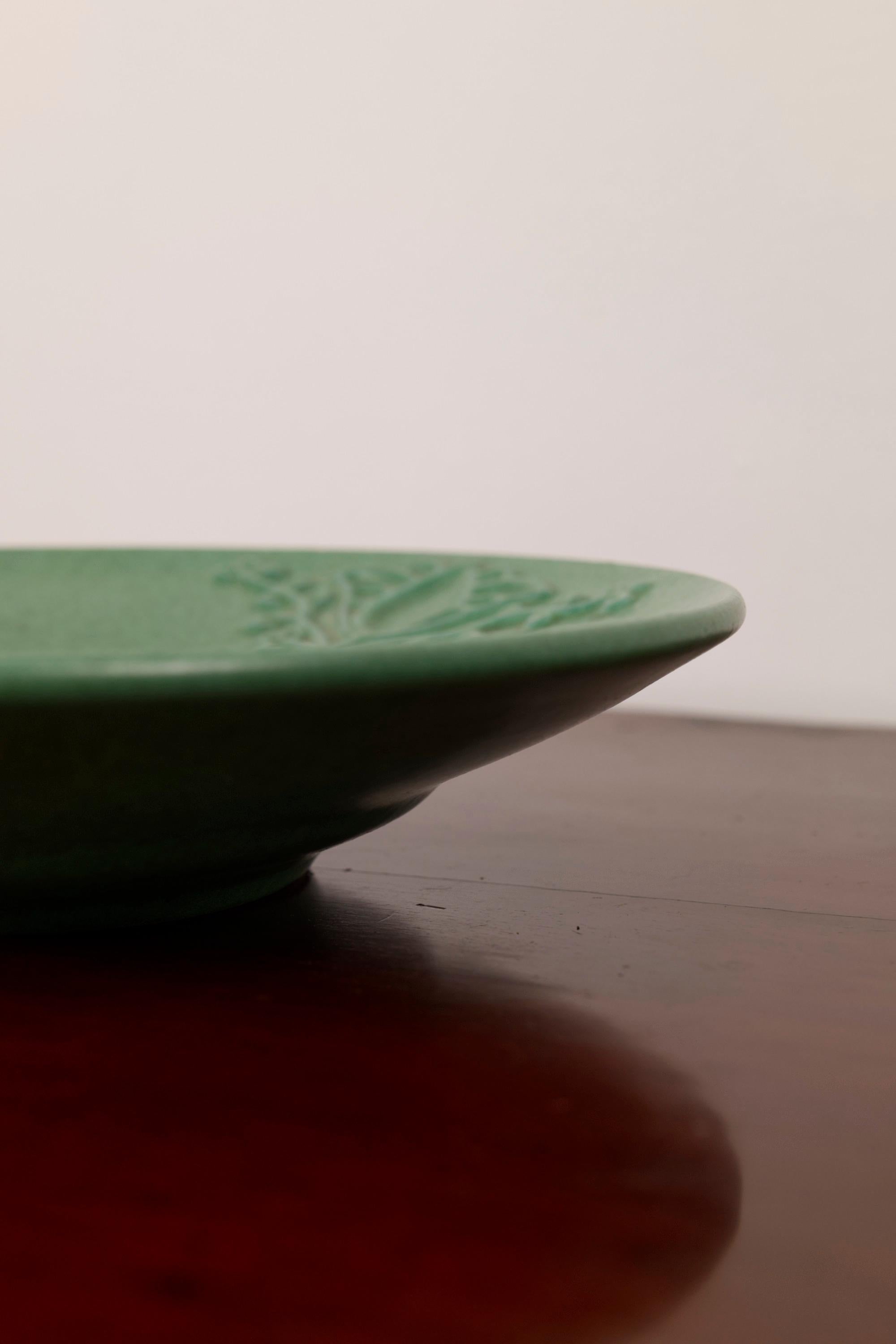 Ceramic A green ceramic Art Deco plate by Michael Andersen, Denmark, 1940s For Sale
