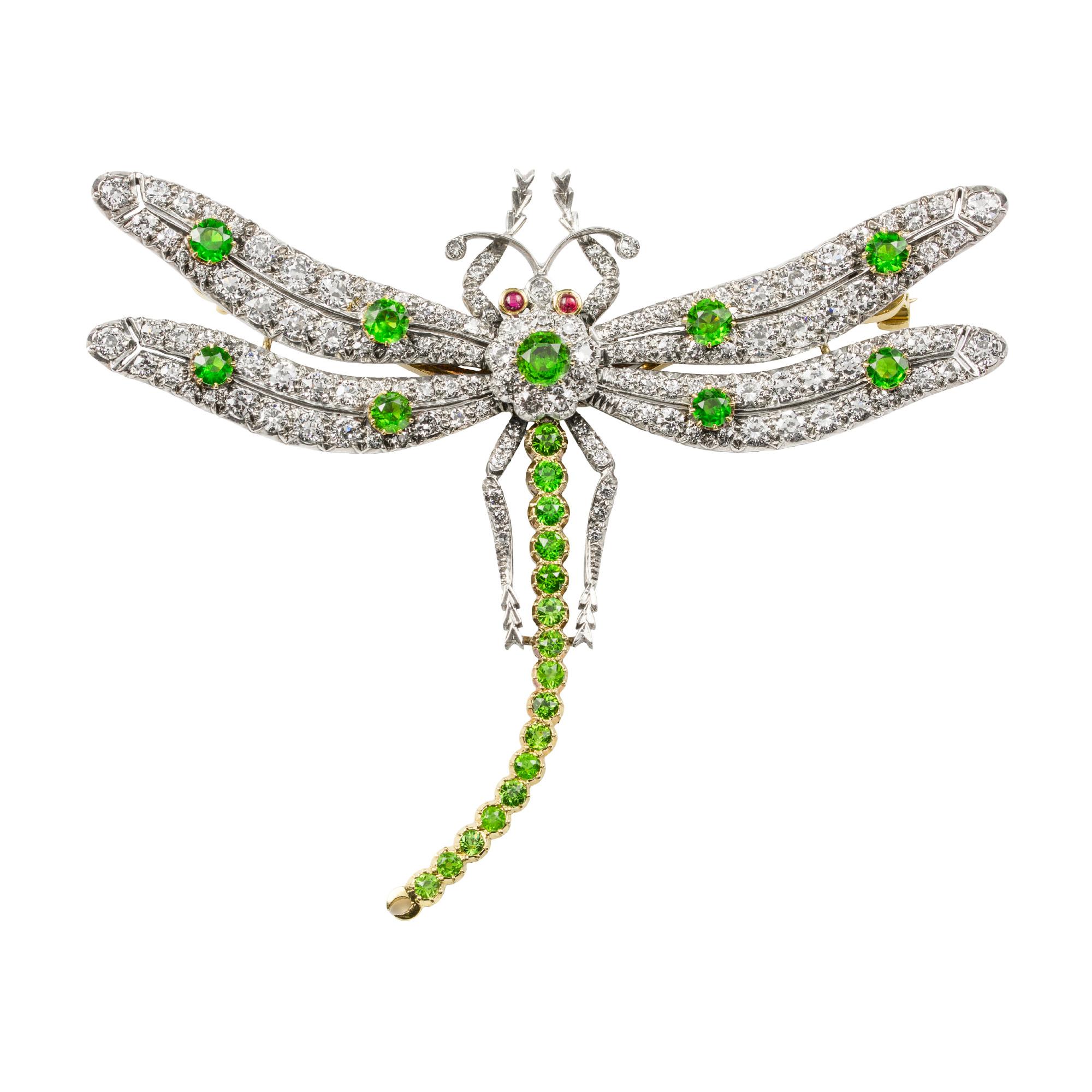 A demantoid garnet and diamond brooch by Bentley & Skinner, in the form of a dragonfly, the en tremblant wings and body encrusted with old brilliant-cut diamonds weighing a total of 6.91 carats, and round faceted dematoid garnets weighing a total of