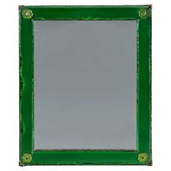 A green glass art deco mirror of small scale 