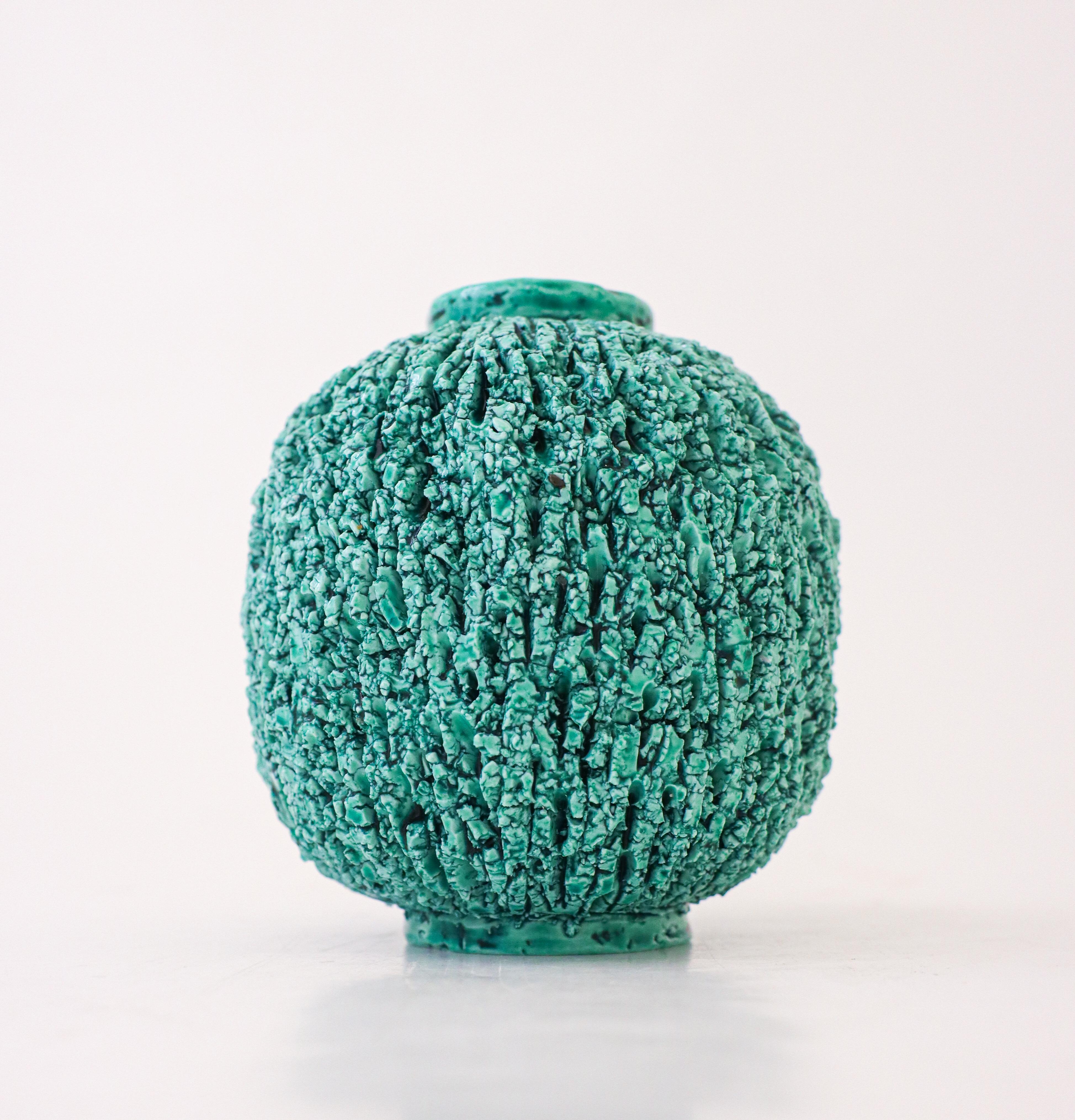 A green Hedgehog-vase designed by Gunnar Nylund at Rörstrand. It is 11 cm (4.4