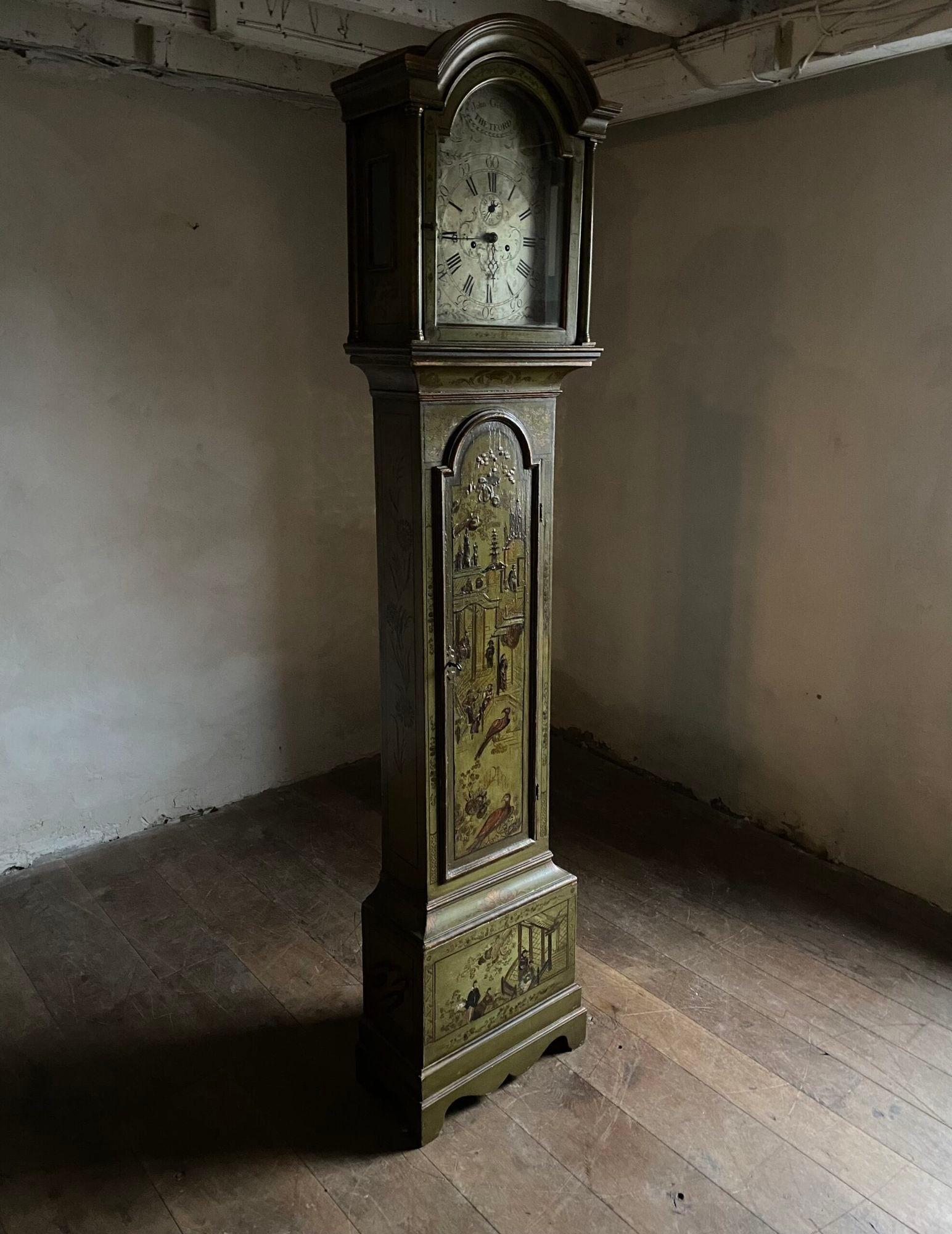 A George III period long case clock with green painted case and lacquered chinoiserie decoration. The steel clock face is signed by John Gibson of Thetford.

Height 218cm