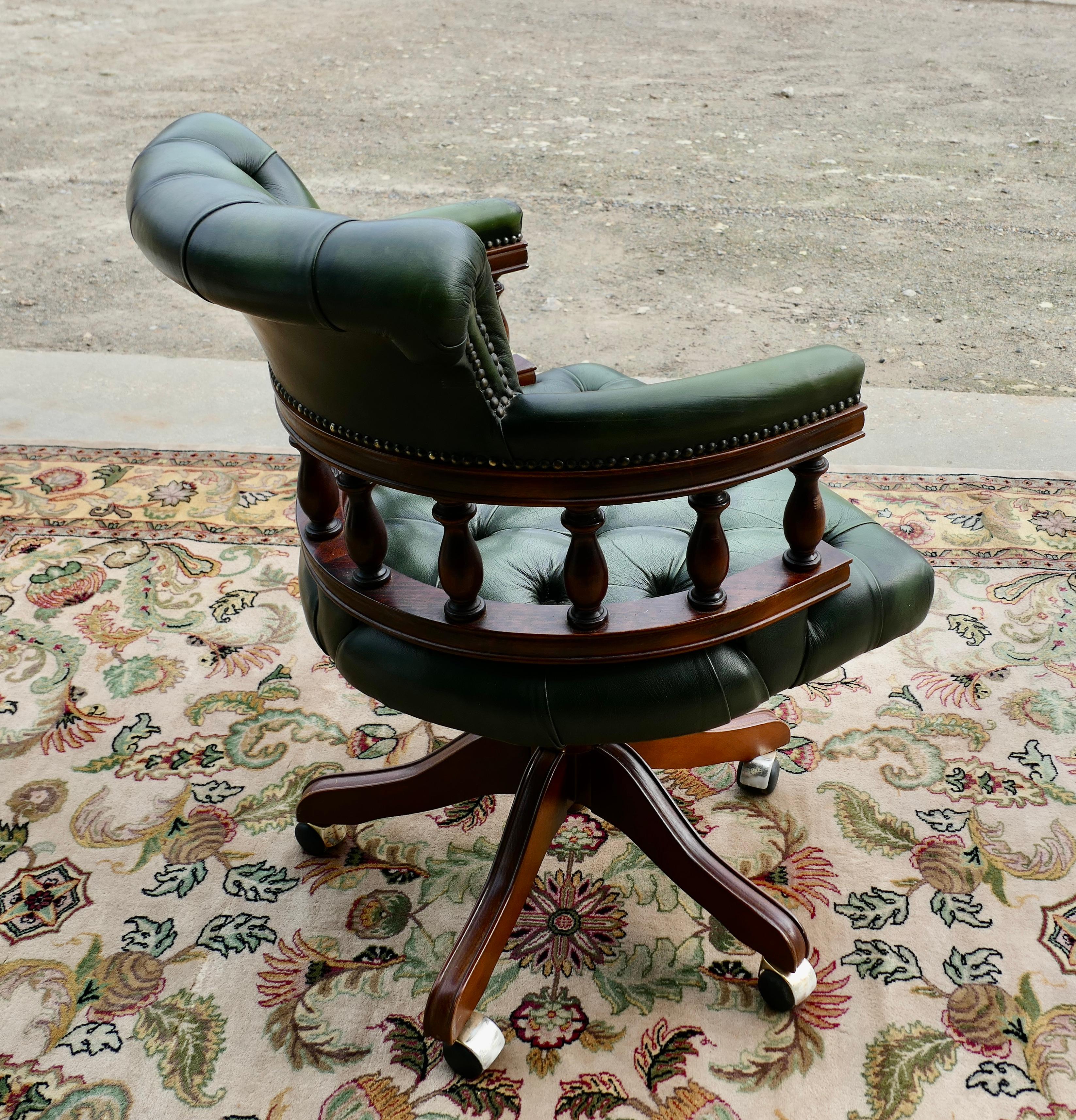 Cowhide A Green Leather Swivelling Desk Chair or Captains Chair