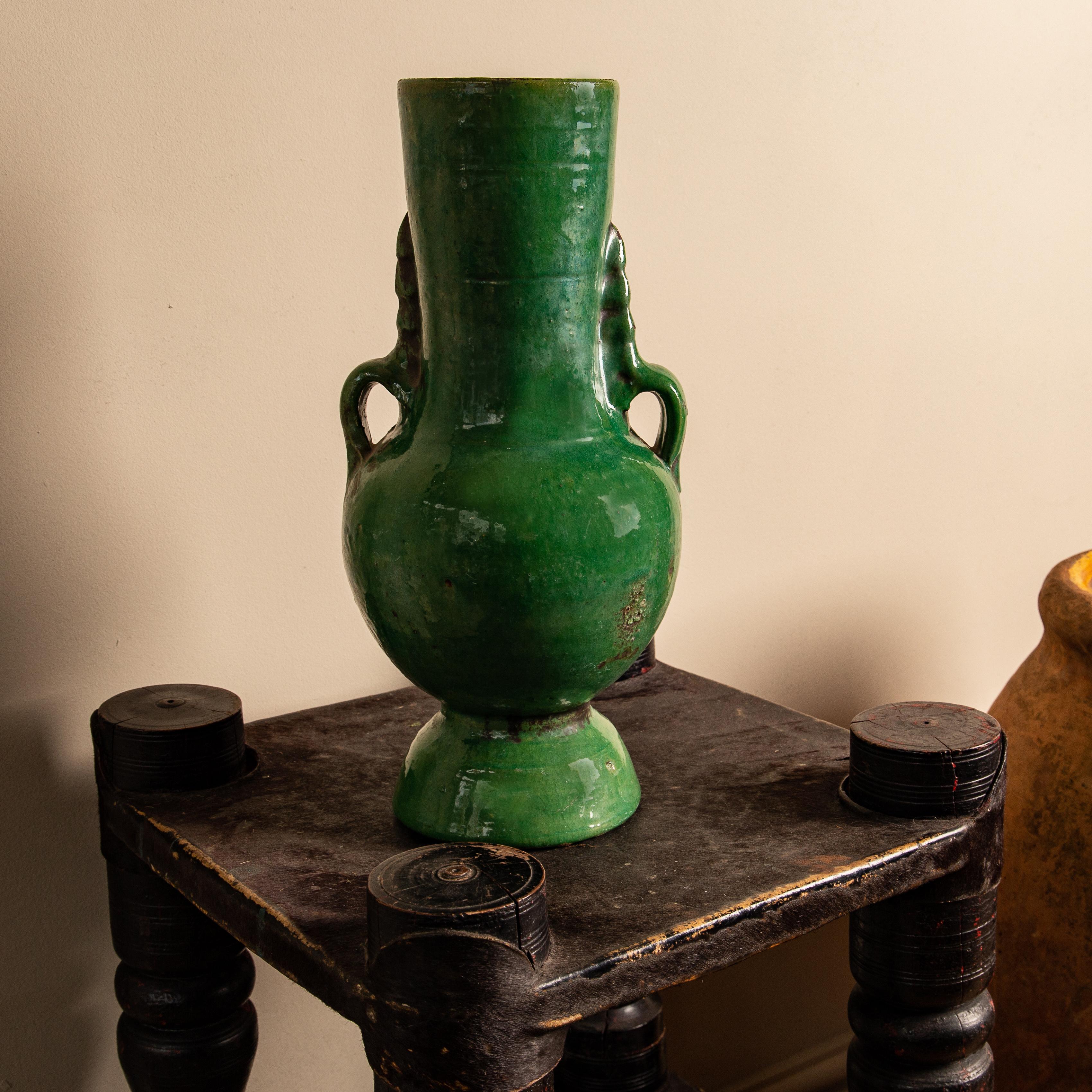 Morocco, circa 1850

Of ancient sculptural form, an original tribal piece from the village of Tamegroute located in the Draa River valley in southern Morocco. With characteristic green glaze showing great patina. Some minor defects around the top