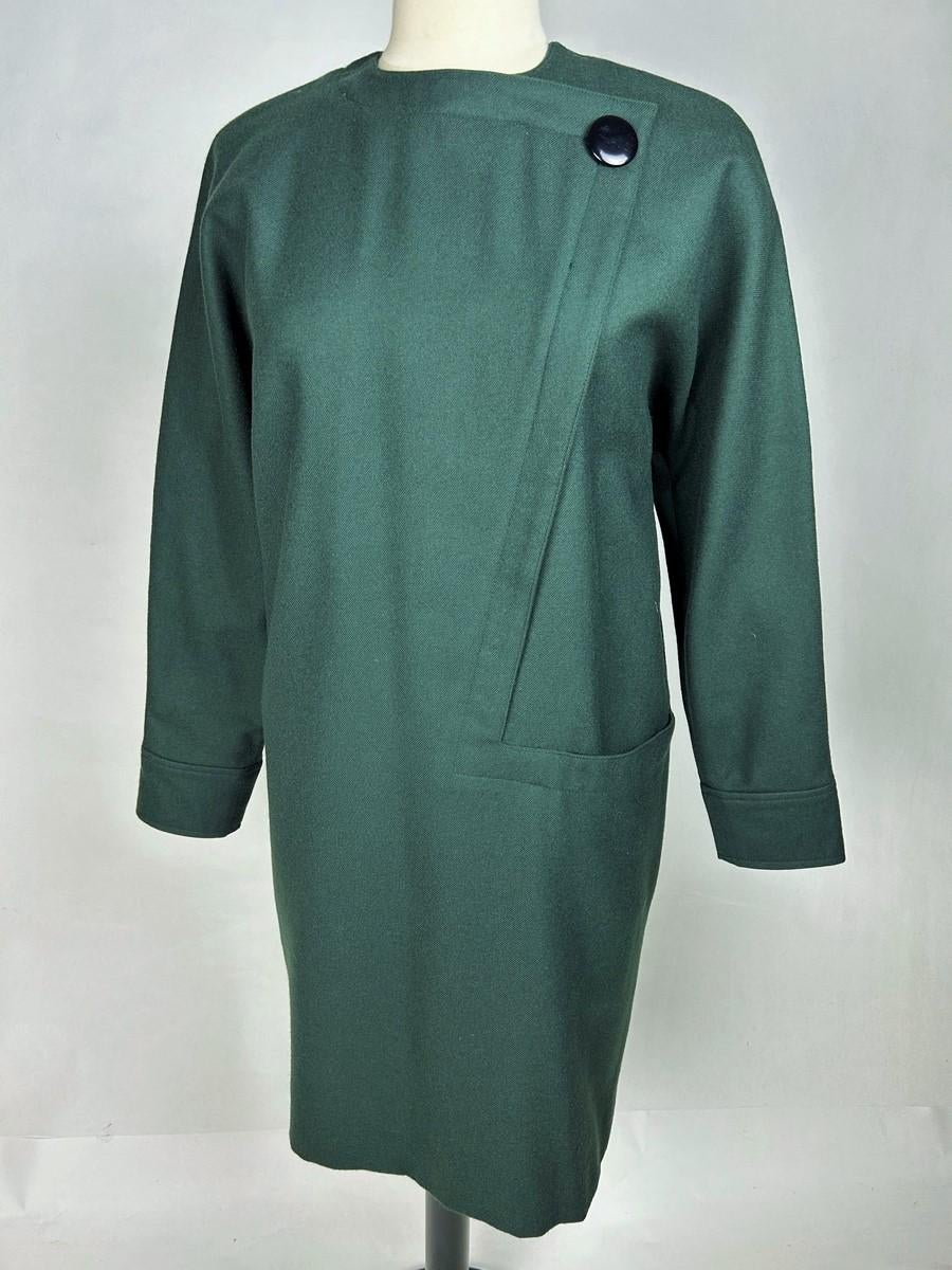 Circa 1985

France

A deep green dress in pure virgin wool in the inimitable style of Monsieur Pierre Cardin dating from the 1980s. Sack-style cut, crew neck and long Kimono sleeves for a flowing batwing silhouette. A Z-shaped topstitched yoke