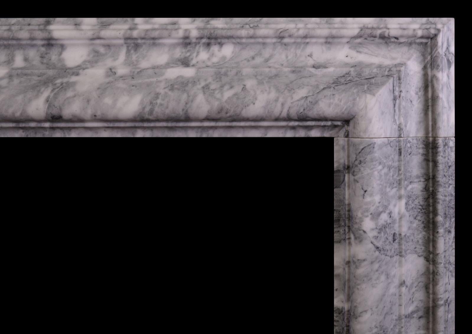  good quality English bolection with moulded frieze and jambs in the classic Queen Anne style. Moulded plinths that follow jamb moulding. English, modern. An interesting mottled grey marble with mild veining in parts. N.B. May be subject to an