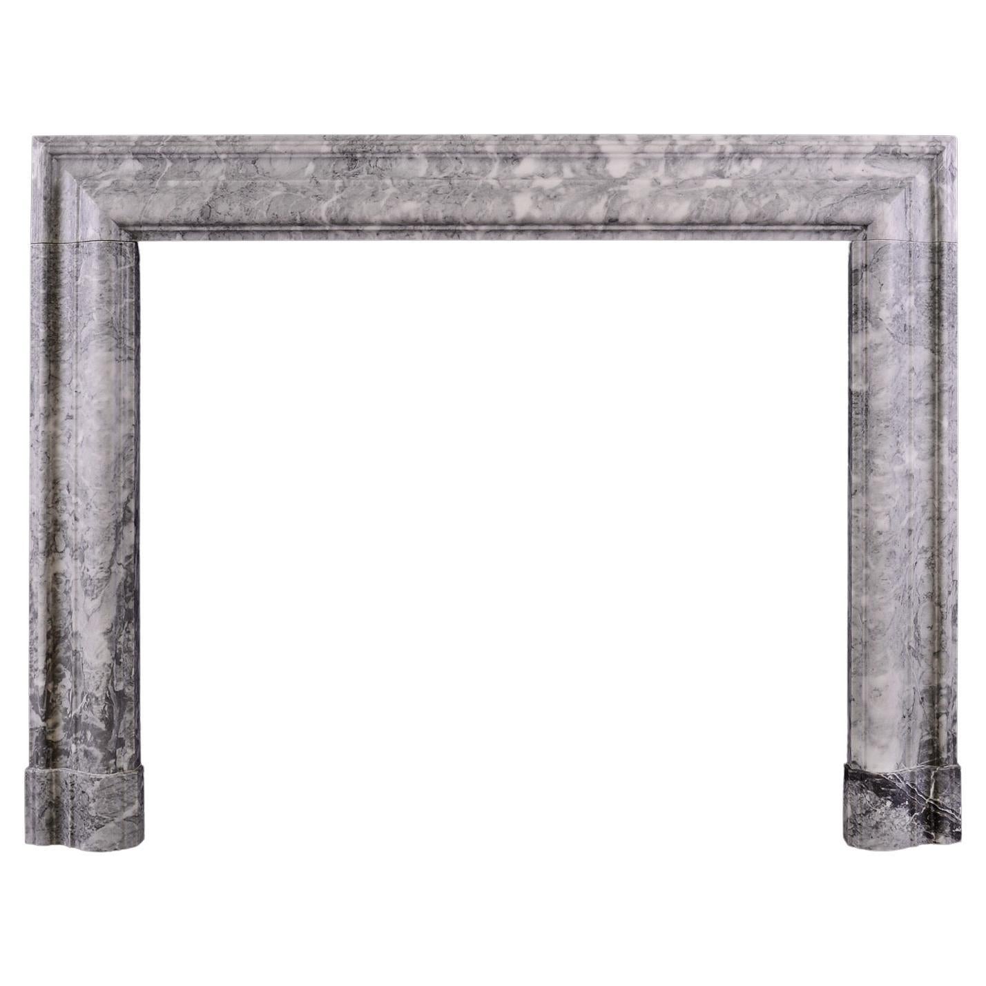 A Grey and White Marble Bolection Fireplace For Sale