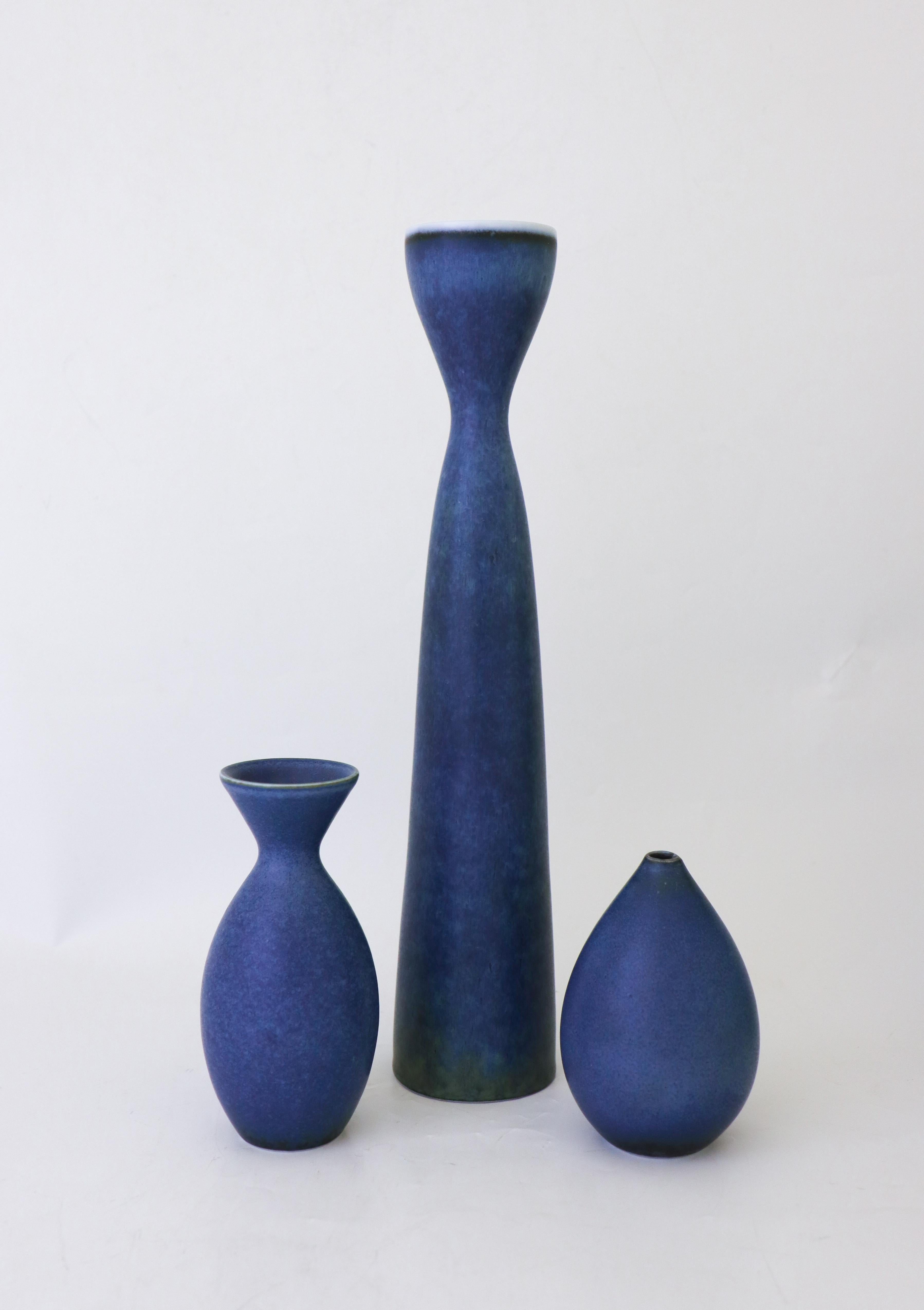 A group of three vases in a lovely deep blue color designed by Carl-Harry Stålhane at Rörstrand. The vases are 31.5, 13 and 10 cm high. They are all in excellent condition and first quality. 

Carl-Harry Stålhane is one of the top names when it