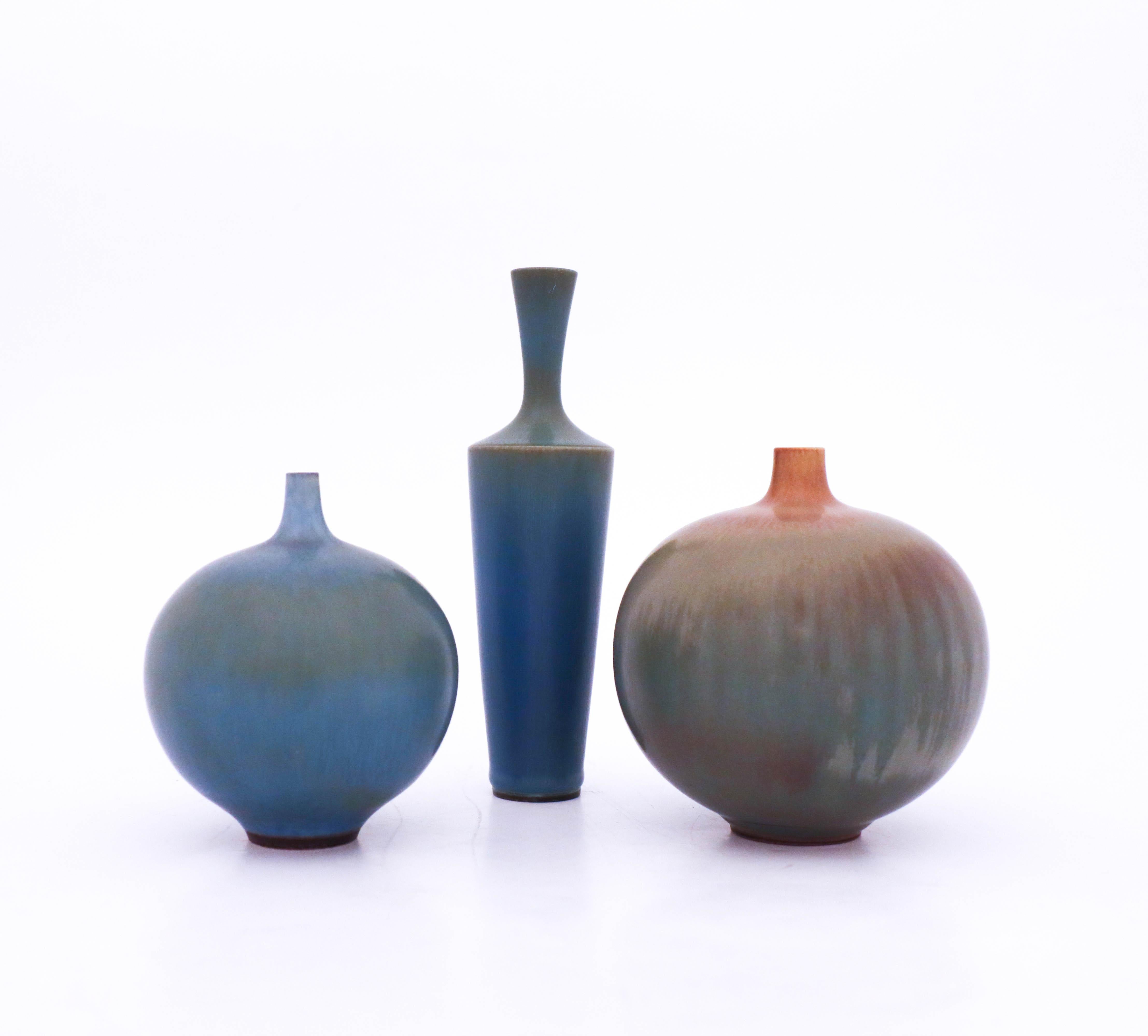A group of three vases designed by Berndt Friberg from Gustavsberg. The vases are 16.5 cm, 11.5 cm and 10.5 cm. They are in very good condition.