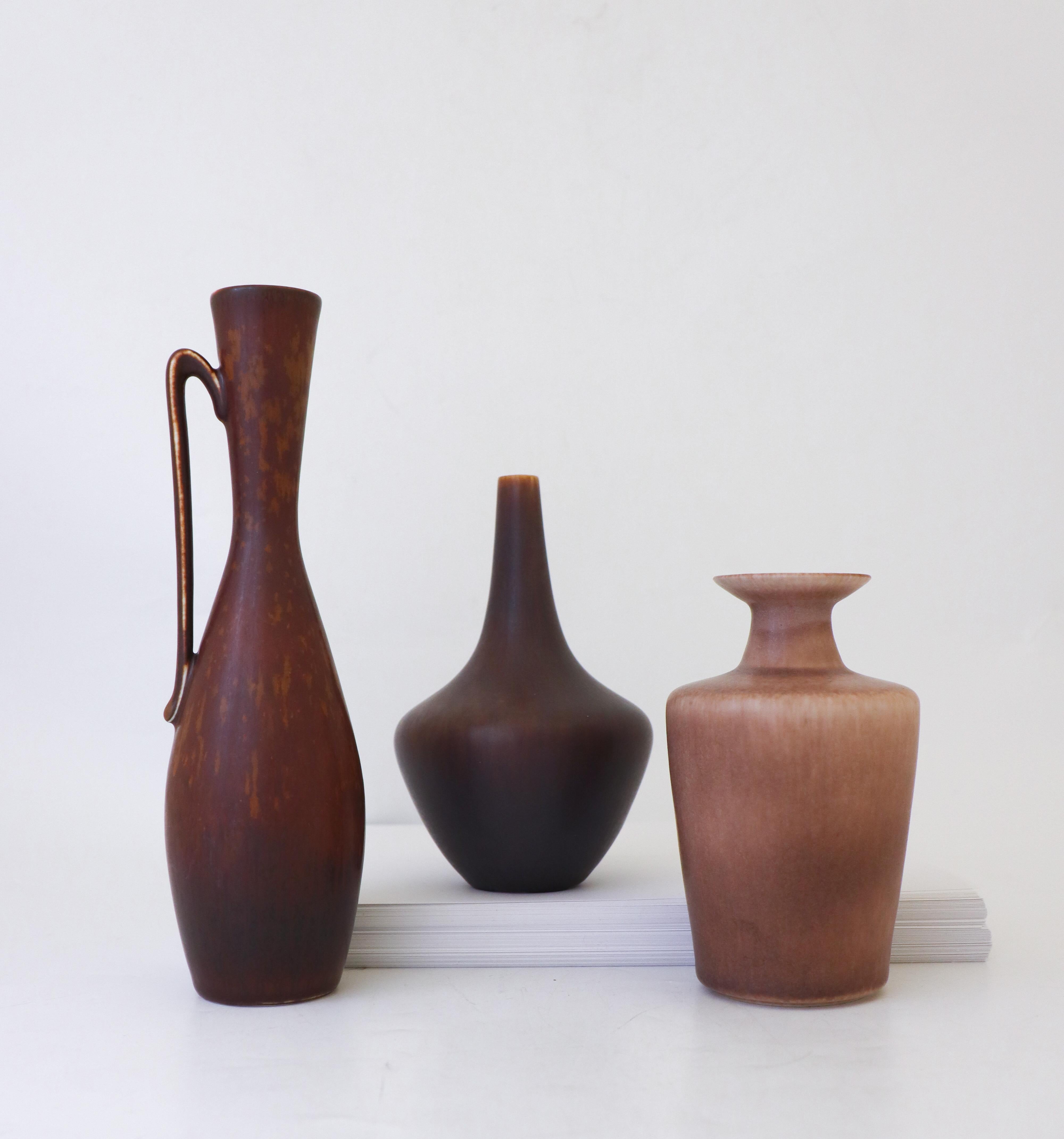 A set of three vases designed by Gunnar Nylund at Rörstrand. The vases are 24.5, 17 and 14.5 cm high. They are all in excellent condition and marked as 1st quality. 

Gunnar Nylund was born in Paris 1904 with parents who worked as sculptors and