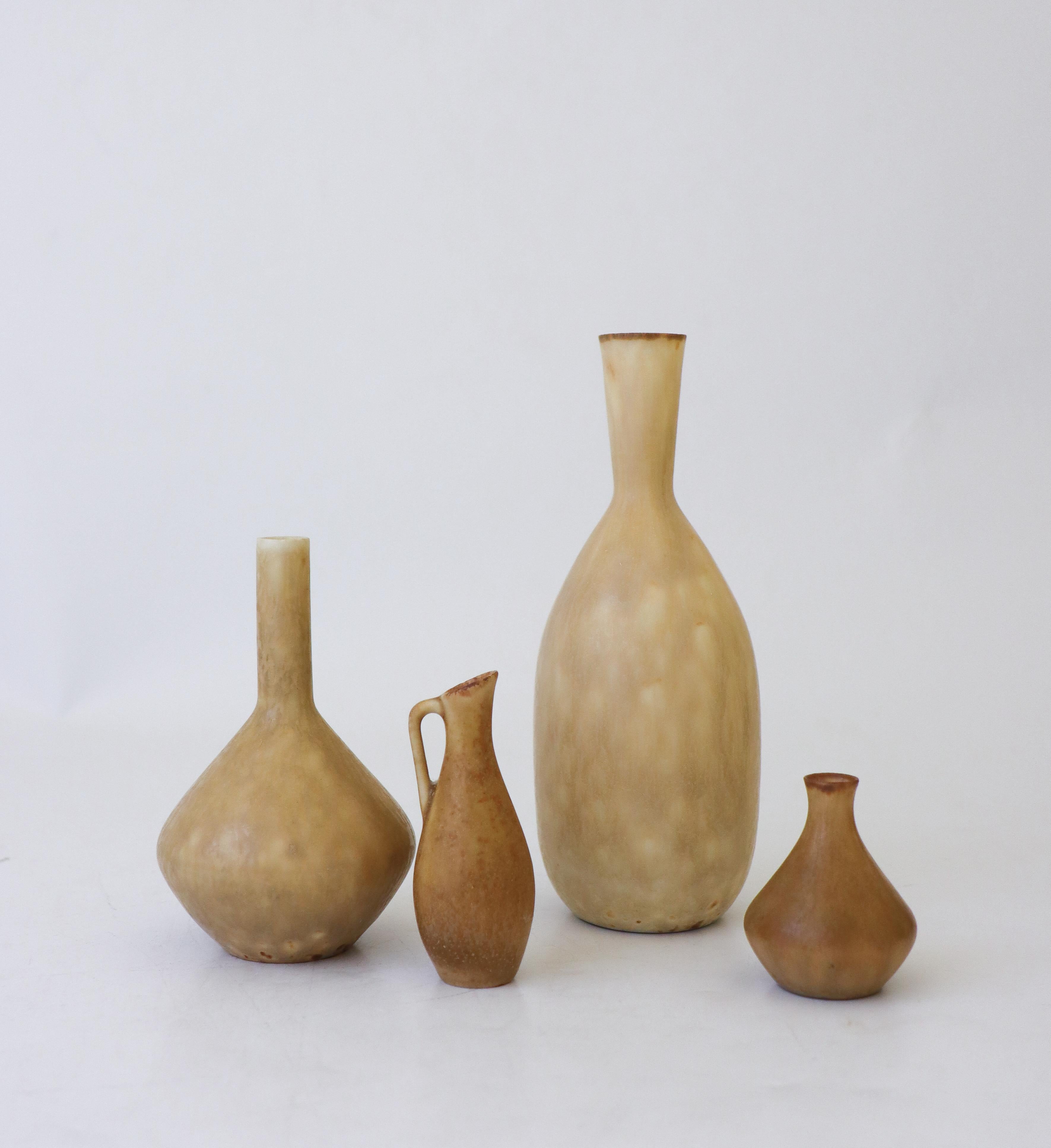 A group of four vases in a yellow/beige glaze designed by Carl-Harry Stålhane at Rörstrand. The vases are 15.5, 10.5, 7.5 and 5 cm high. They are all in excellent condition and first quality. 

Carl-Harry Stålhane is one of the top names when it