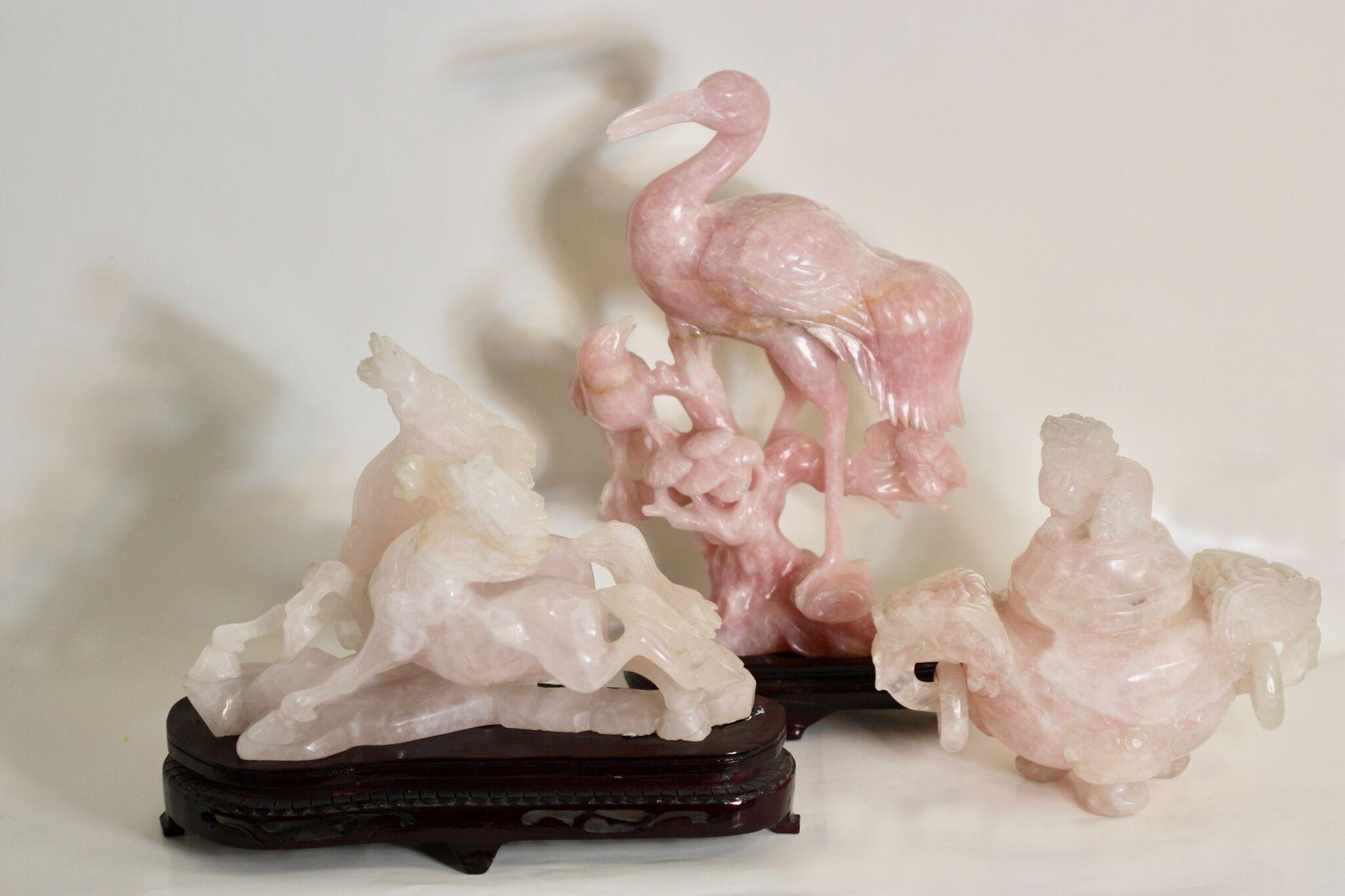 A group of Chinese rose quartz carvings
20th century
Comprising of:
A Chinese rose quartz censer and cover of octagonal form supported on three legs, flanked by a pair of animal mask loop handles, each face carved with an animal mask, the domed