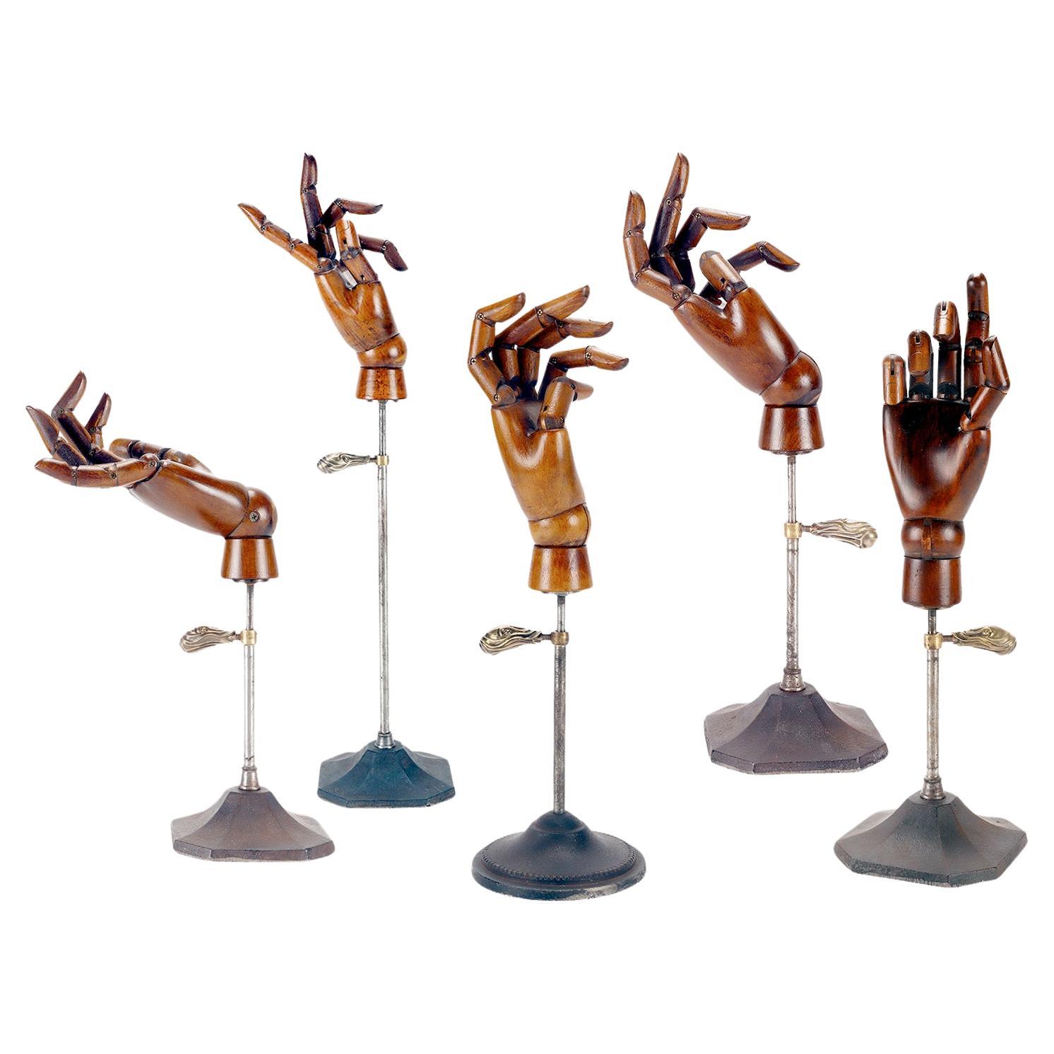 A group of five example of wooden articulated dummie’s hands. Italy, 1900.