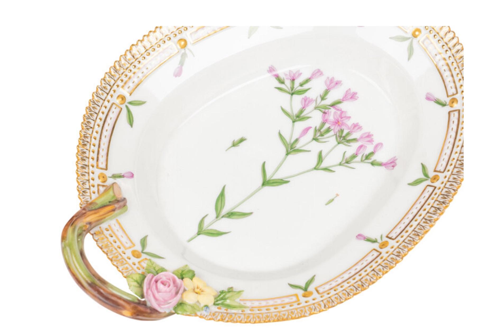 A Group of Four Royal Copenhagen Flora Danica Porcelain Serving Articles. comprising a serving platter, a triangular shallow bowl, and two ovoid dishes with handles (one smaller than the other); each with crown and three-wave marks to