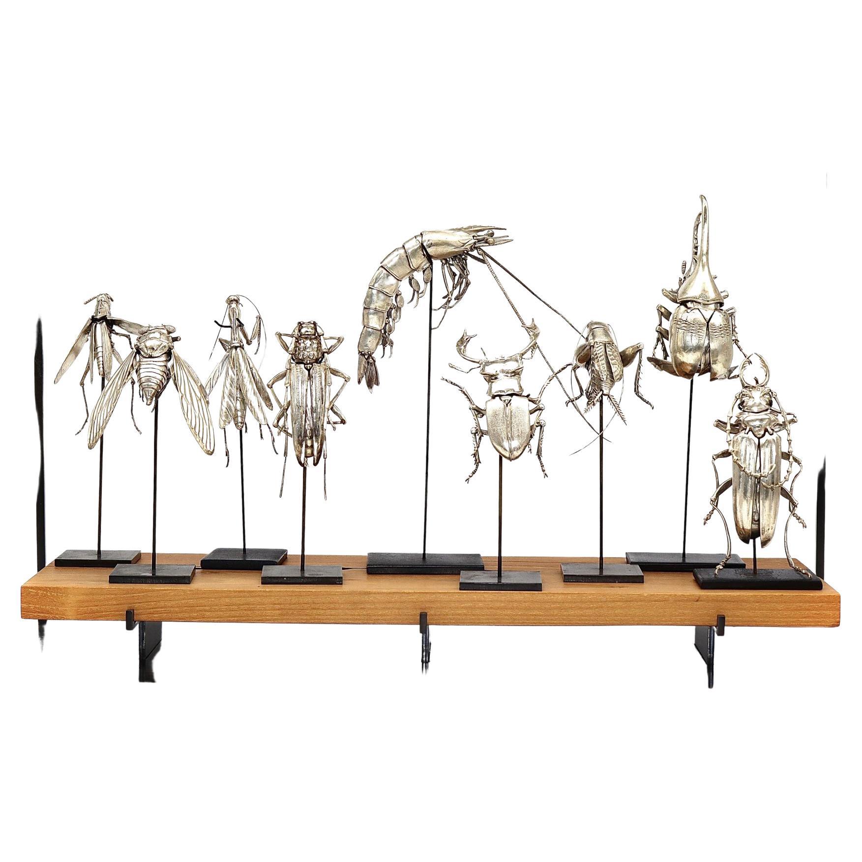 A group of nine American silver articulated creatures by Oleg Konstantinov. This incredible set includes a cicada, staghorn beetle, Hercules beetle, longhorn beetle, hardwood stump borer beetle, grasshopper, praying mantis, cricket, and shrimp, each