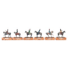 Un groupe de six sculptures en argent, marbre et émail, Italie 1920.