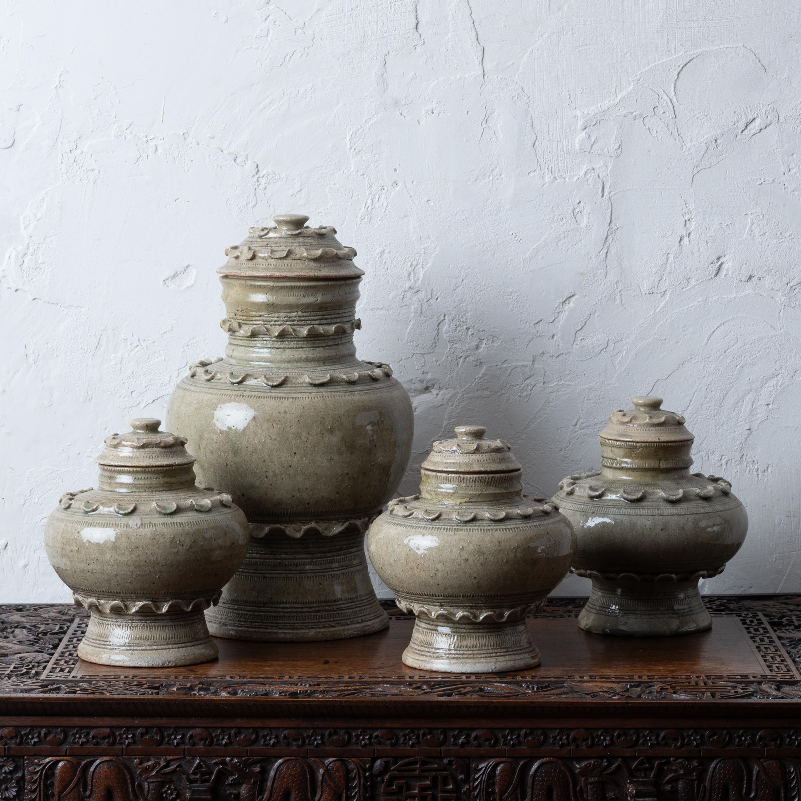 A group of four celadon jars made in Thailand for Rosenthal-Netter, circa 1960s.

Larger: 9 inches wide by 15 ½ inches tall 
other three: 7 ½ inches wide by 8 ½ inches tall 

