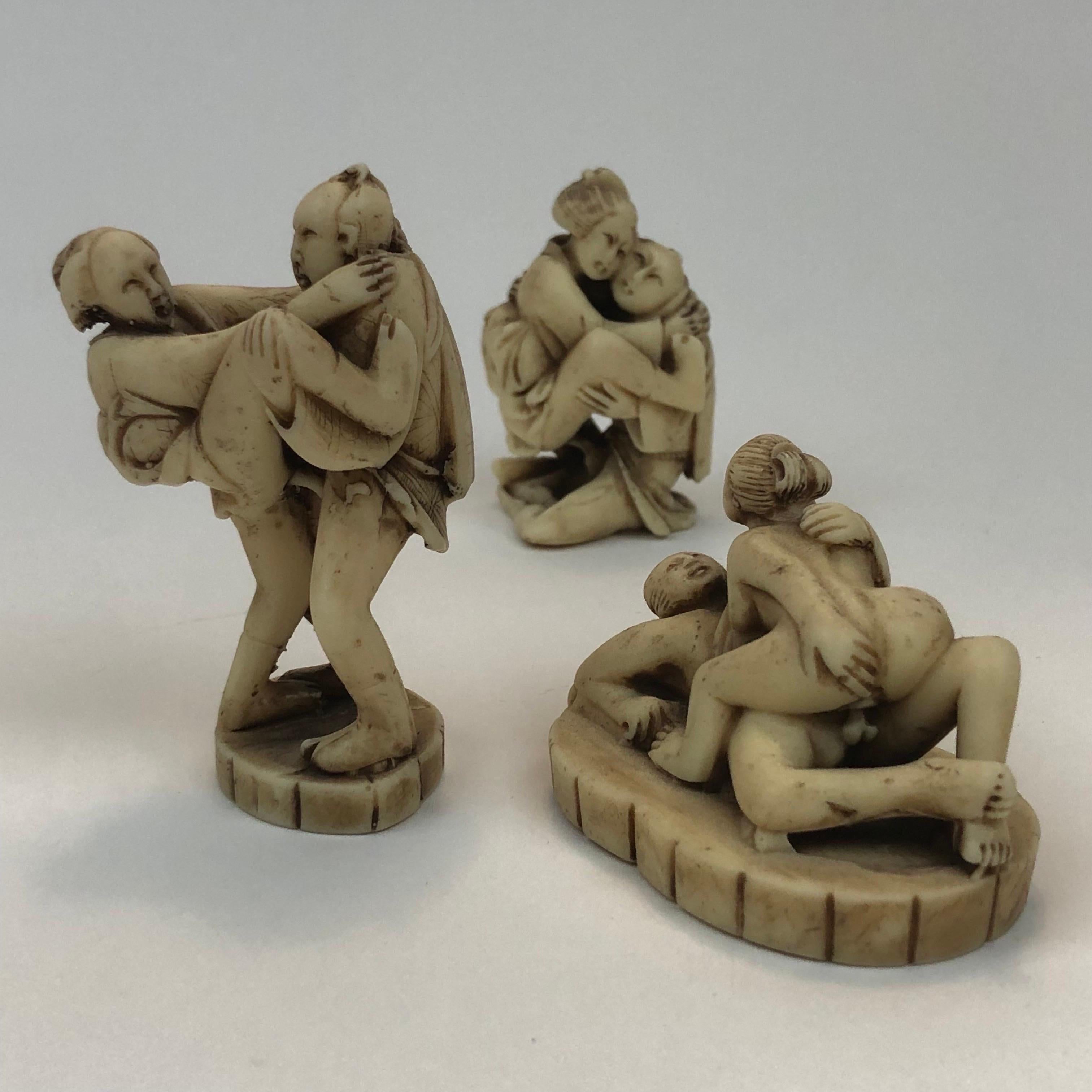 A set of three erotic hand carved resin netsuke figurines depicting Edo period Japanese couples in various states of coitus. 
Acquired from the same collection these appear to be from the early 1900's and bear all the slight wear and accumulated