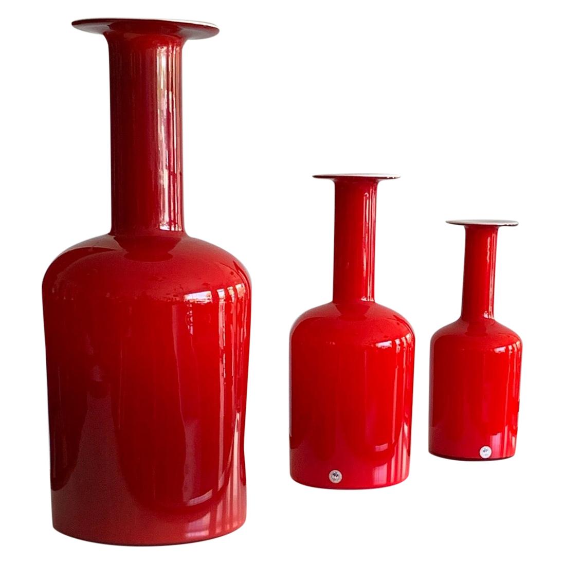 Group of Three Red Otto Bauer Holmegaard Bottles