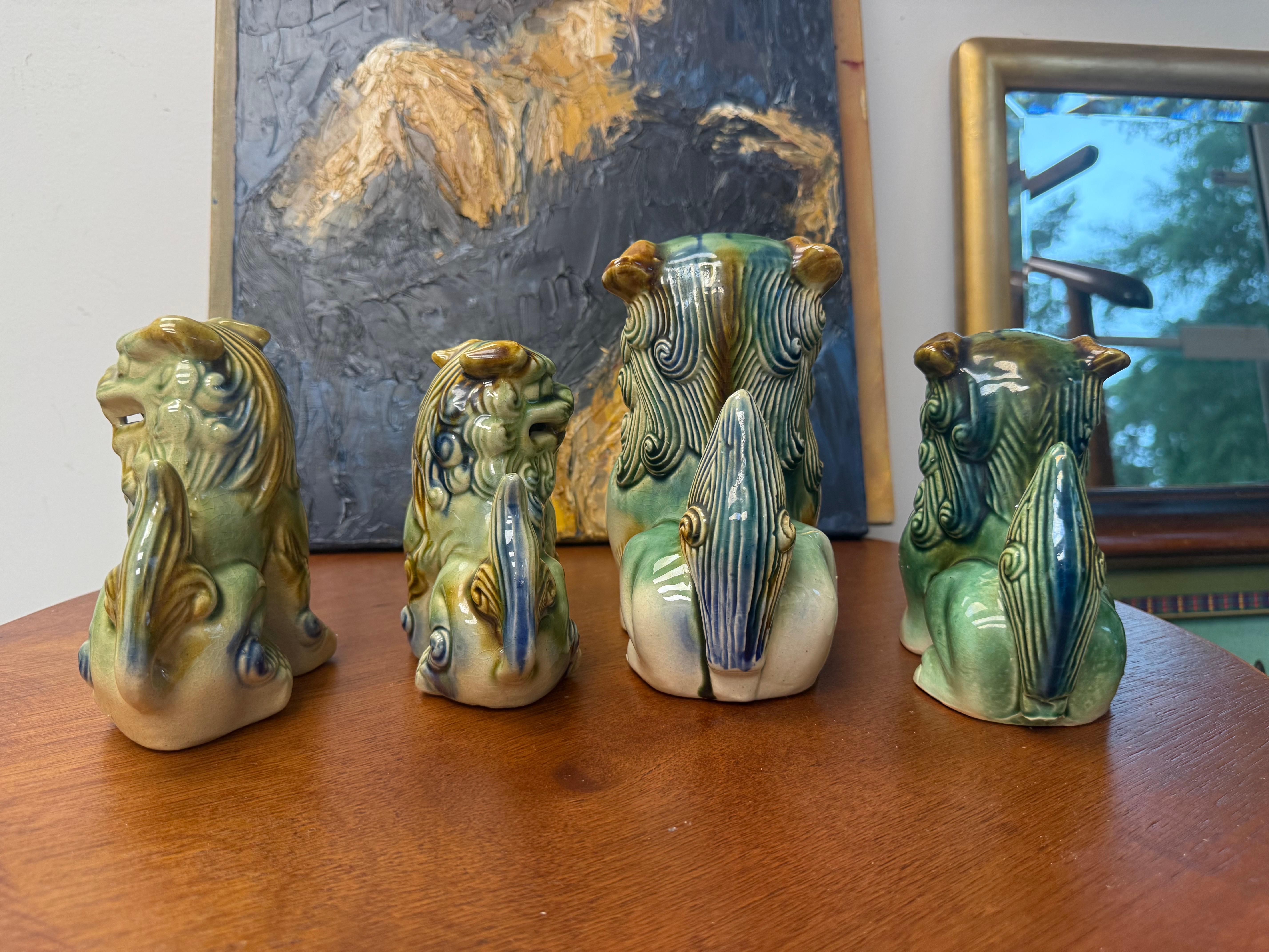 Chinese Export A Grouping of Mid-Century Ceramic Polychrome Foo Dogs - A Set of 4 For Sale