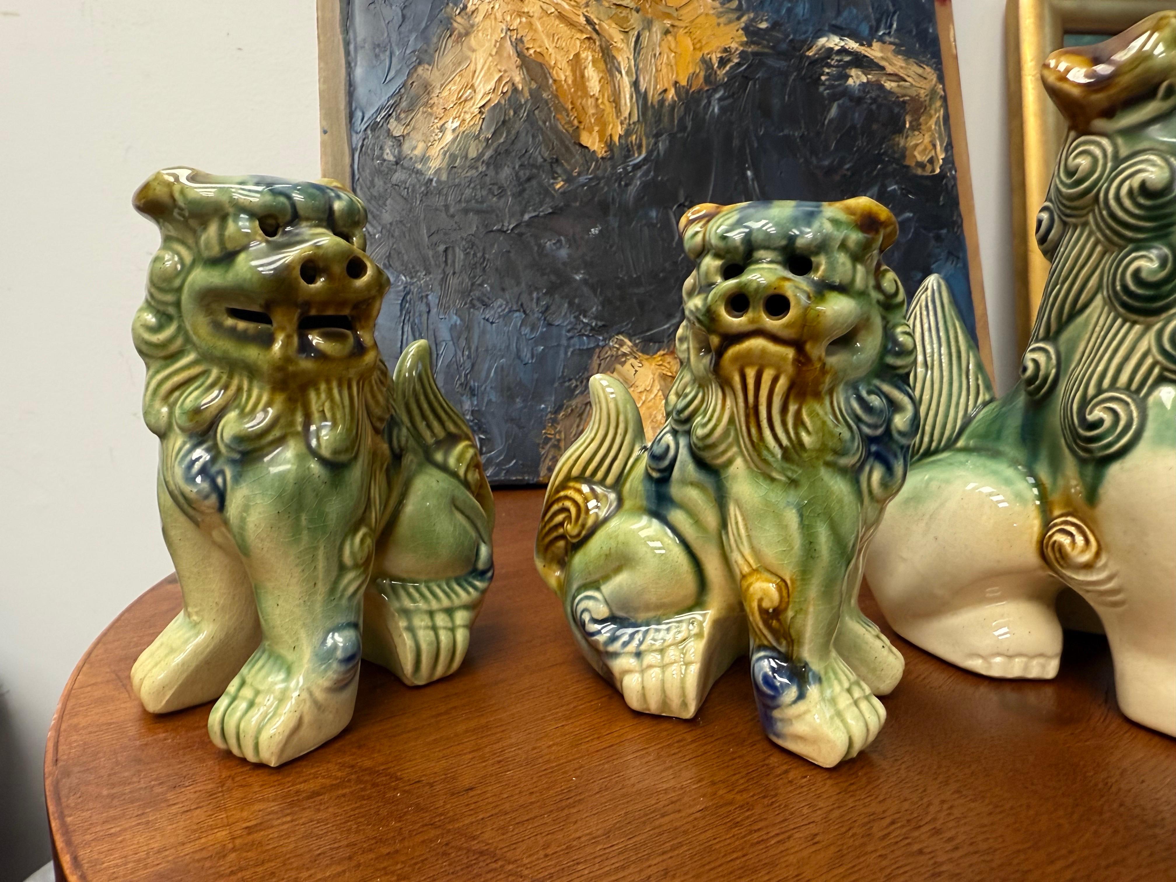 A Grouping of Mid-Century Ceramic Polychrome Foo Dogs - A Set of 4 In Good Condition For Sale In Charleston, SC