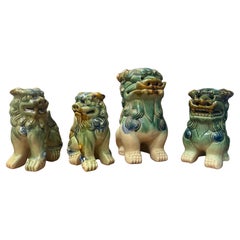 A Grouping of Mid-Century Ceramic Polychrome Foo Dogs - A Set of 4