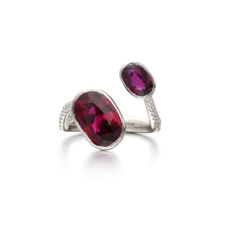 Composed of 2 oval-shaped rubies, accented by diamonds. 
- Ruby weighs 4.57 carats 
- Smaller ruby weighs approximately 1.00 carat
 - Diamonds weighing a total of approximately 0.90 carat
 - Platinum 
- Total weight 7.84 grams
 - Size 6 
-