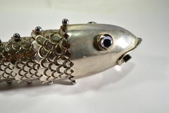 A Gucci bottle opener Fishin silver-plated metal Italy 1970