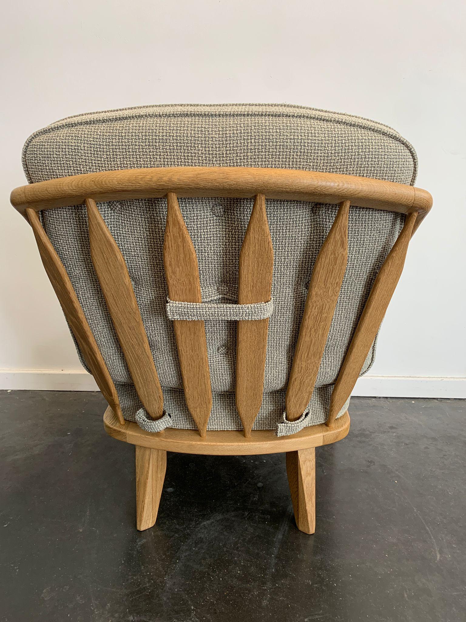 an solid oak and fabric armchair by Guillerme et Chambron edition Votre Maison circa 1960