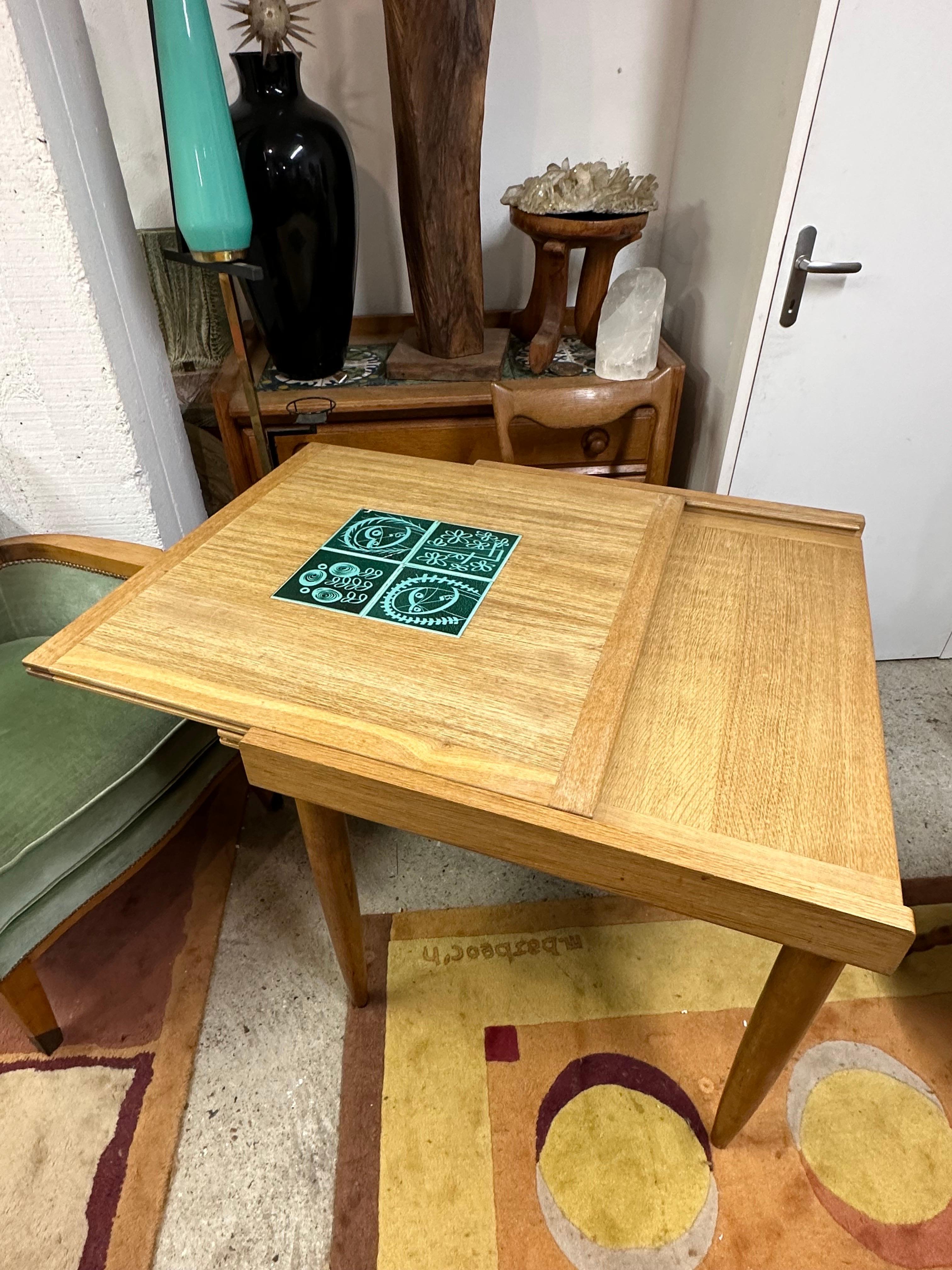 An extendable oak table Guillerme et Chambron Edition Votre Maison with ceramic by Danikowski.