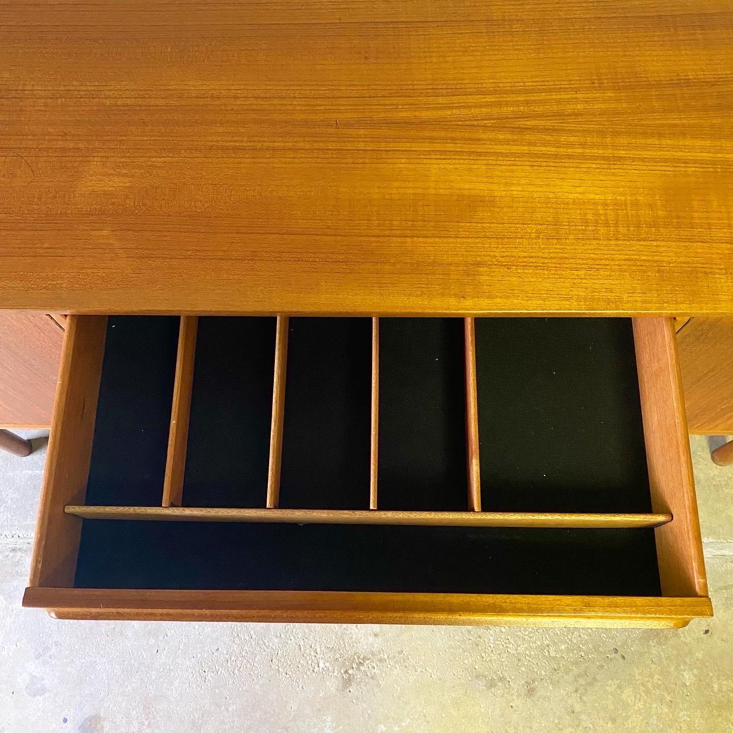 This is an incredible Danish teak sideboard produced by A. H. McIntosh in Scotland, ca. 1960’s. Along with G. Plan, A. H. McIntosh produced high quality teak Danish style furniture in an effort to compete with all of the high end Danish furniture