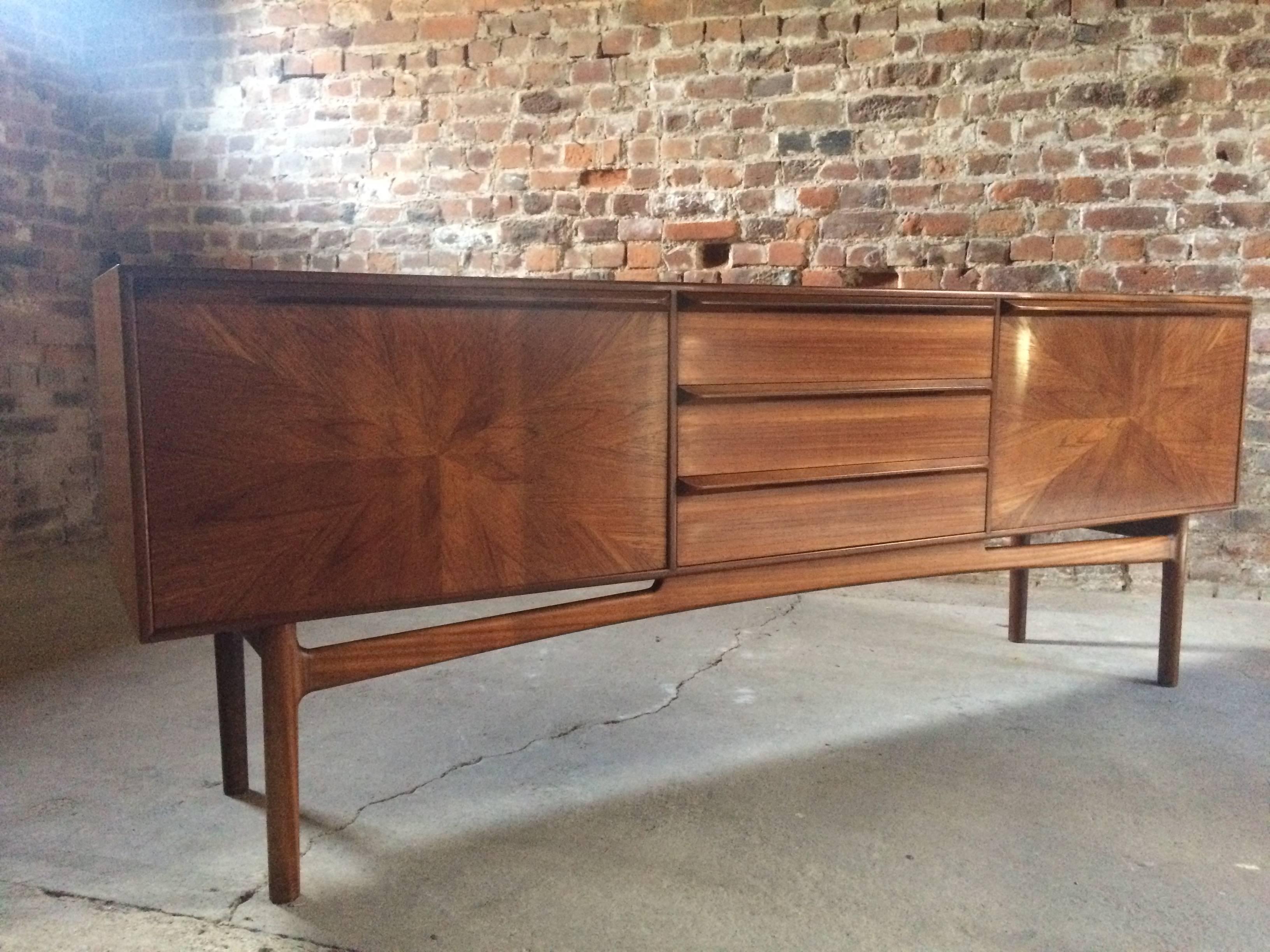 Fabulous rare midcentury A H McIntosh of Kirkaldy Scotland solid teak 'Sunburst' credenza sideboard, circa 1960s, the sideboard is offered in superb condition with no marks or stains having just undergone a full restoration, the rectangular top over