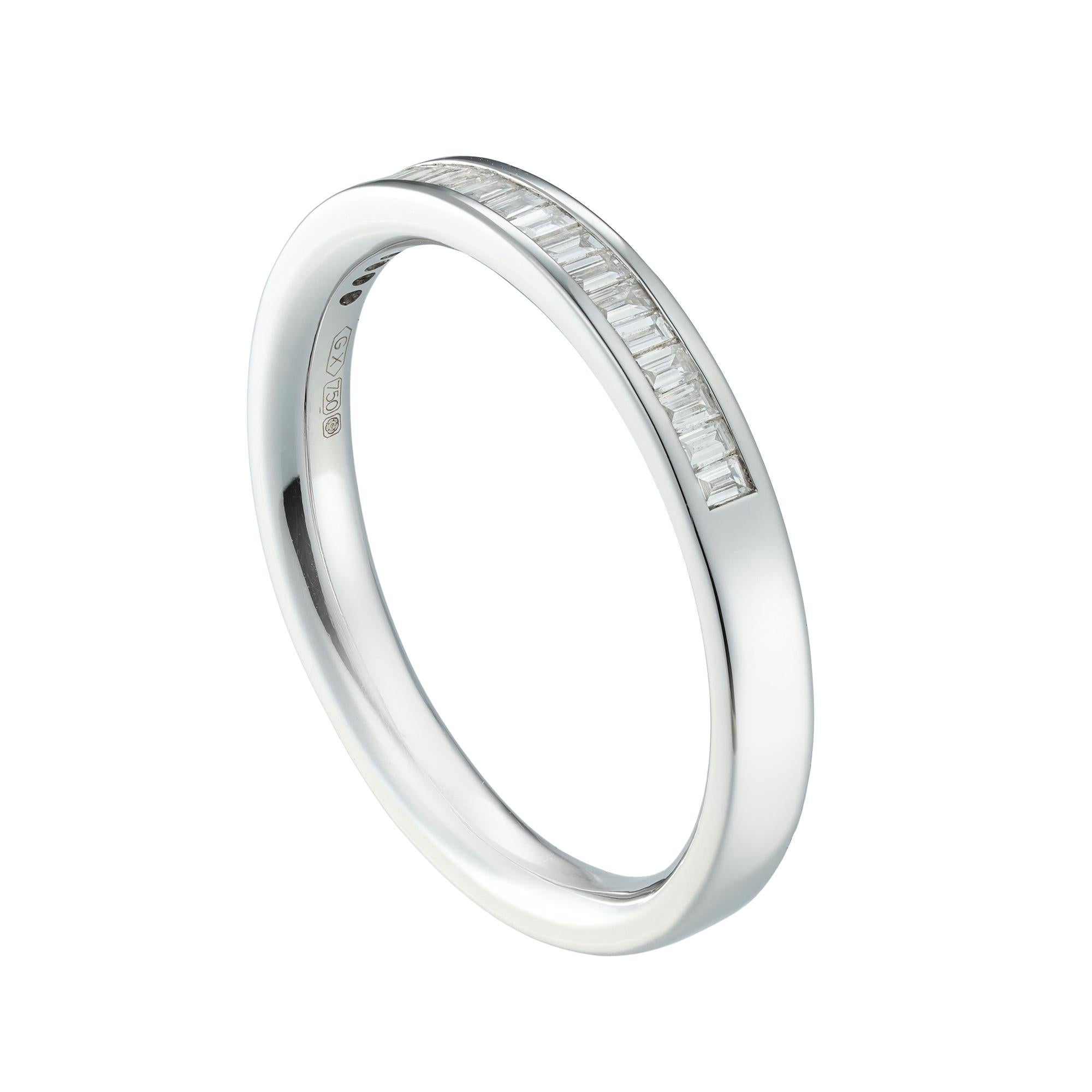 A half eternity diamond ring, consisting of nineteen baguette-cut diamonds, weighing 0.33 carats in total, all channel-set in white gold mount, hallmarked 18ct gold Sheffield, measuring 3mm wide, finger size Q, gross weight 4.1 grams.

A charming