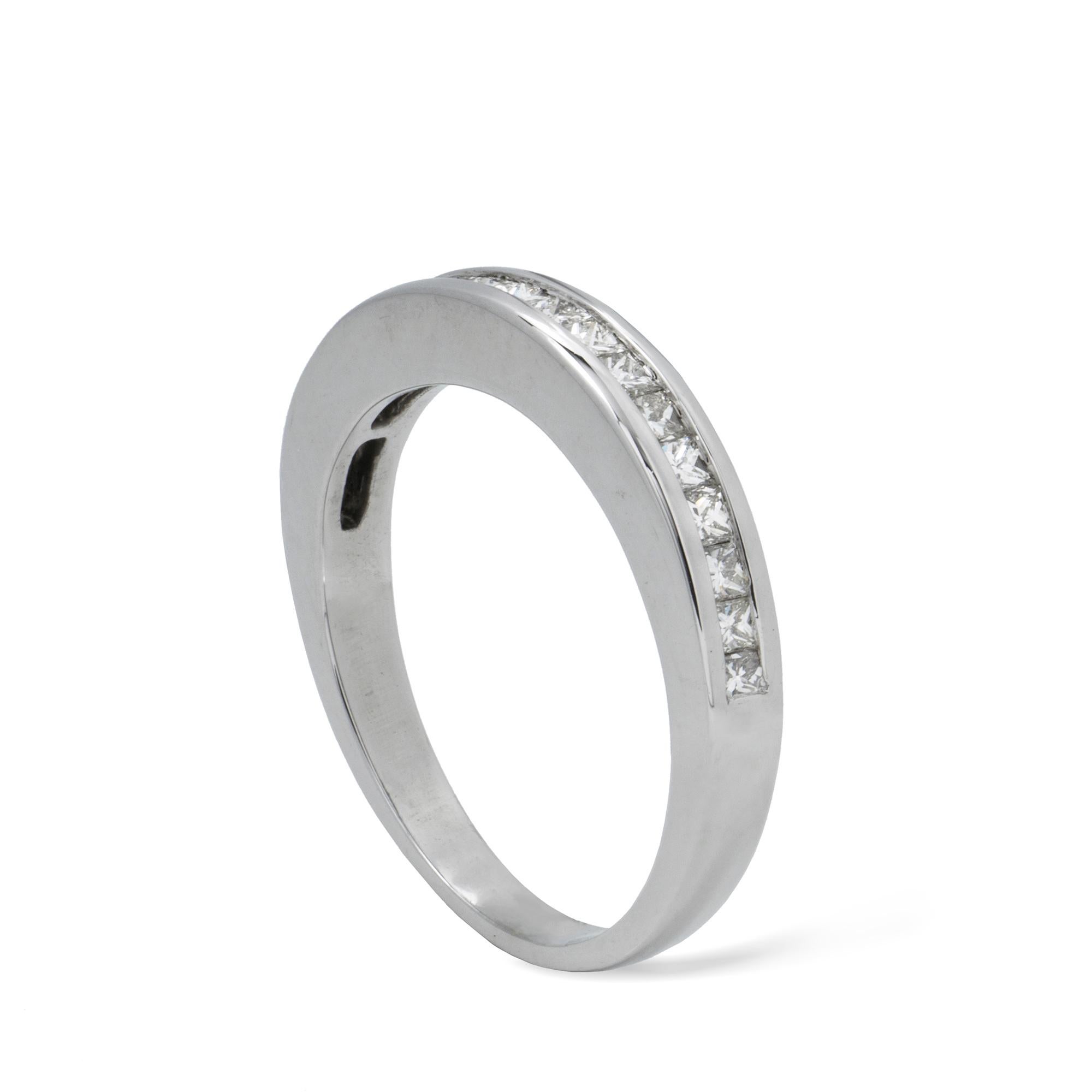 A half eternity diamond ring, the nineteen princess-cut diamonds with total estimated weight 0.50 carats, channel-set in a white gold mount, hallmarked 18ct gold London, bearing the Bentley & Skinner sponsor-mark, gross weight 2.5 grams,  Finger
